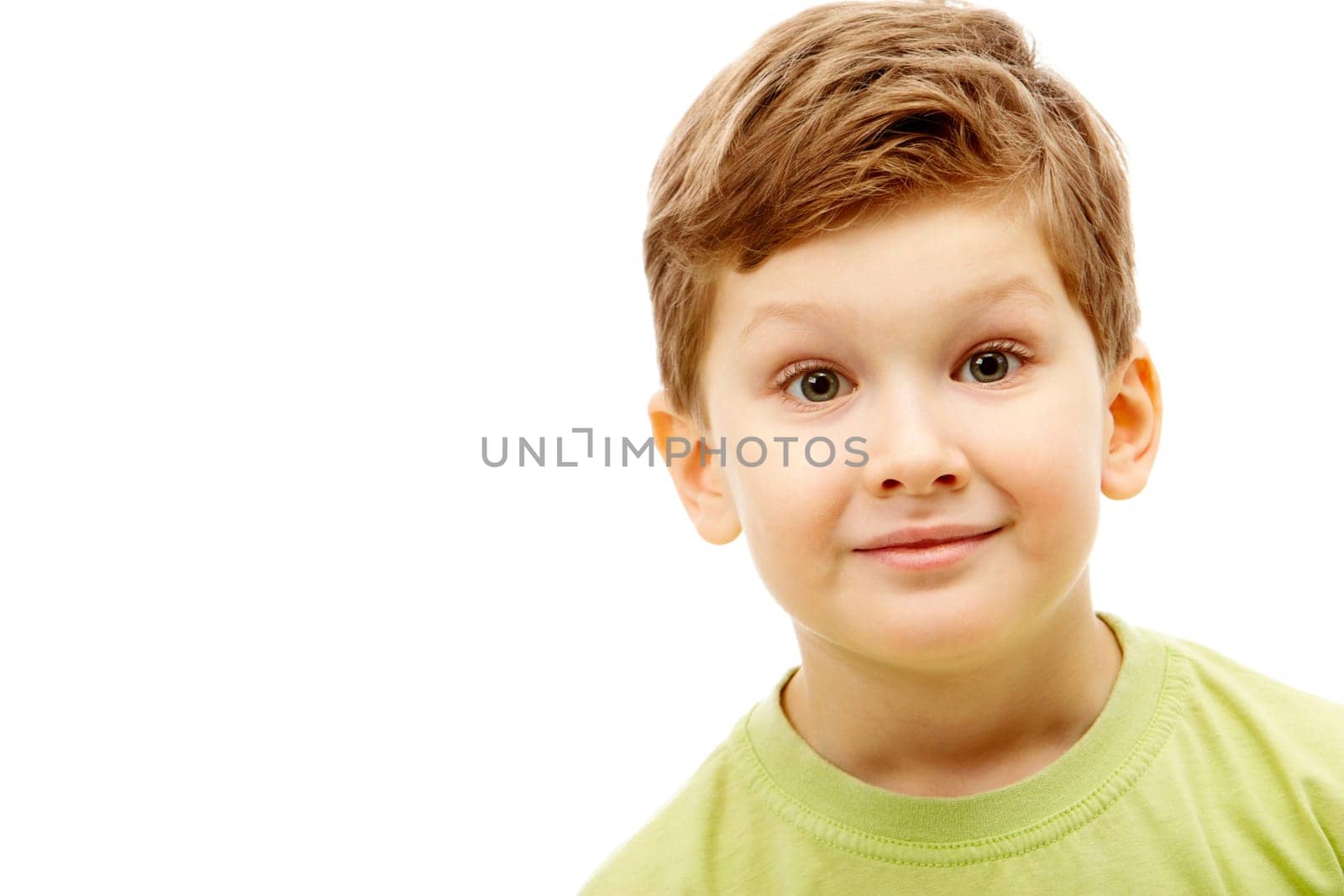 Portrait of young boy wearing green t-shirt isolated on a white background