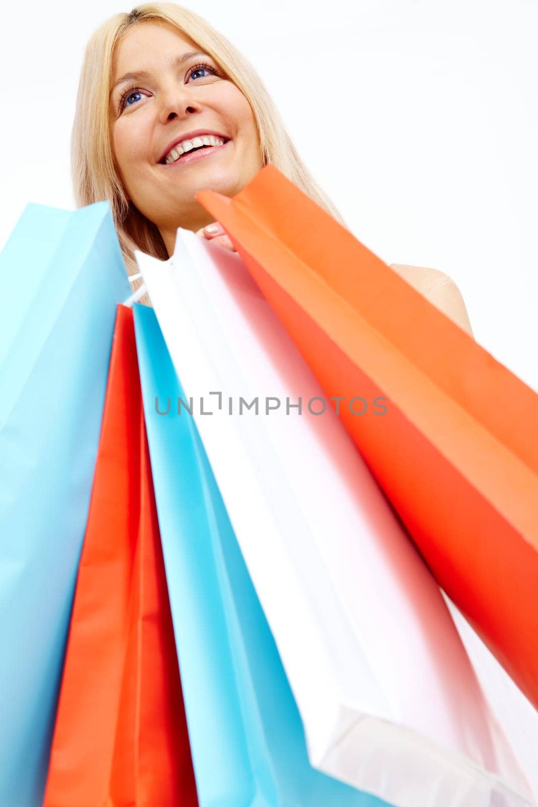Photo of happy female with colorful shopping bags