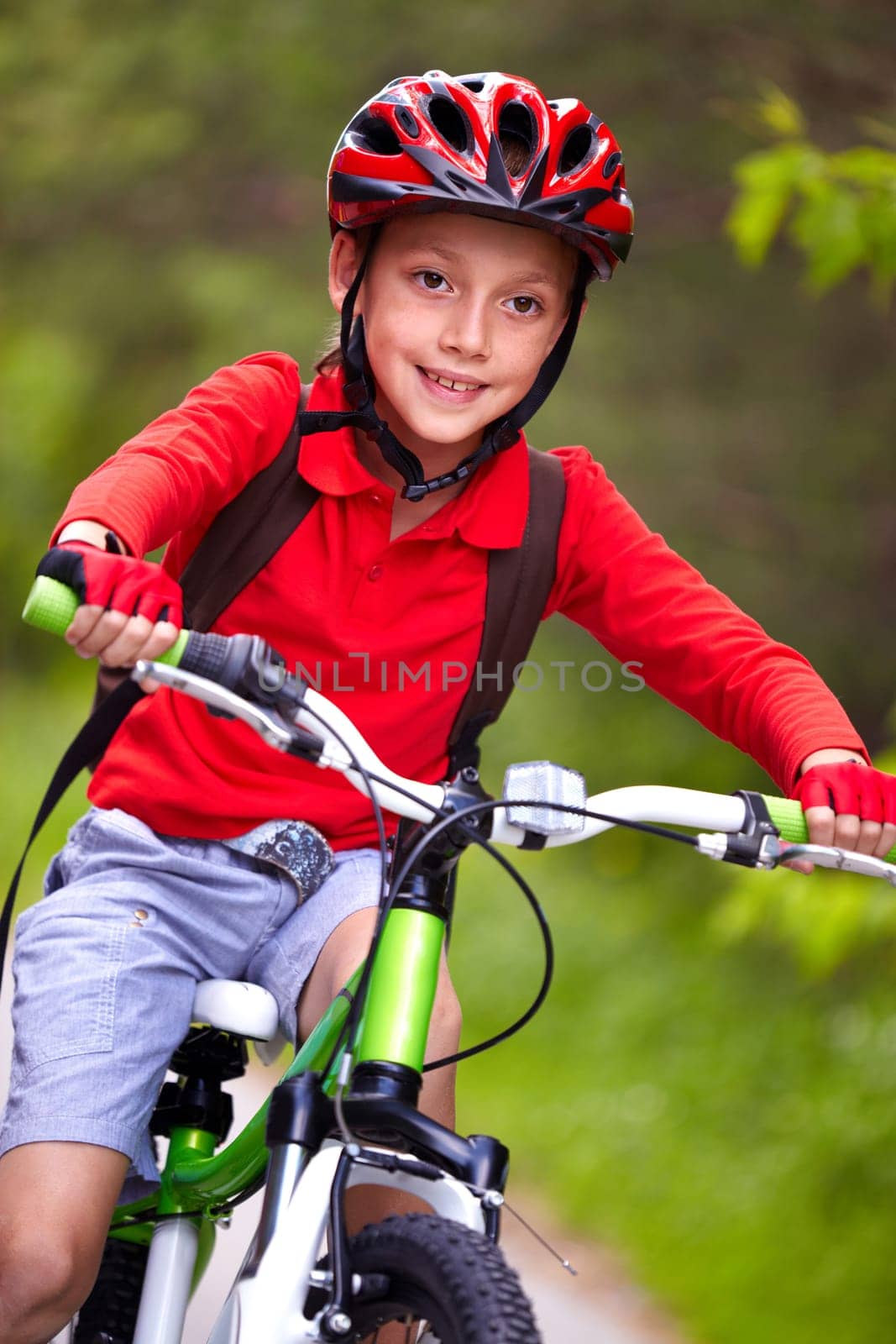 Portrait of a boy riding a bike