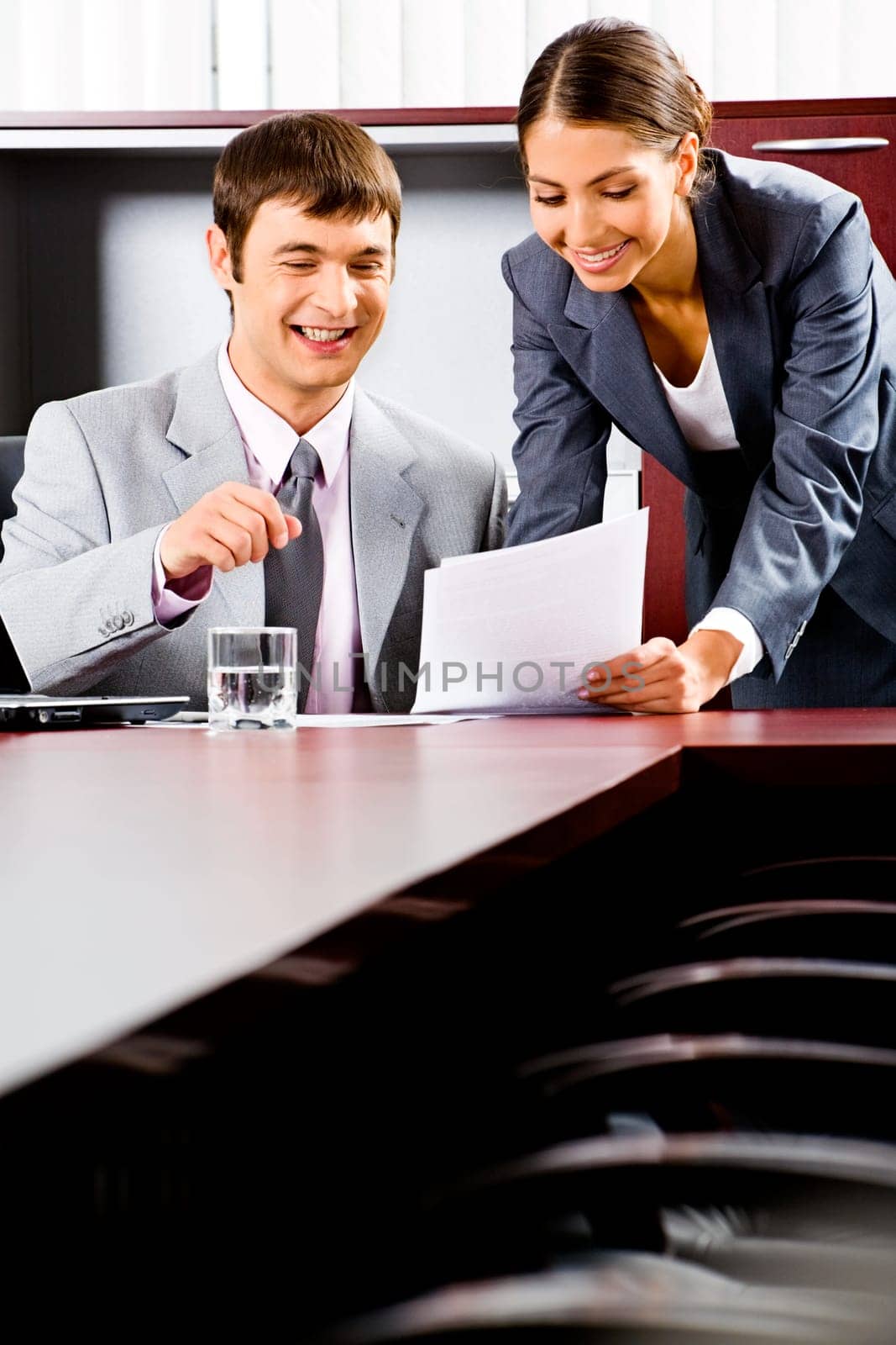 Portrait of business man and woman working together in the boardroom