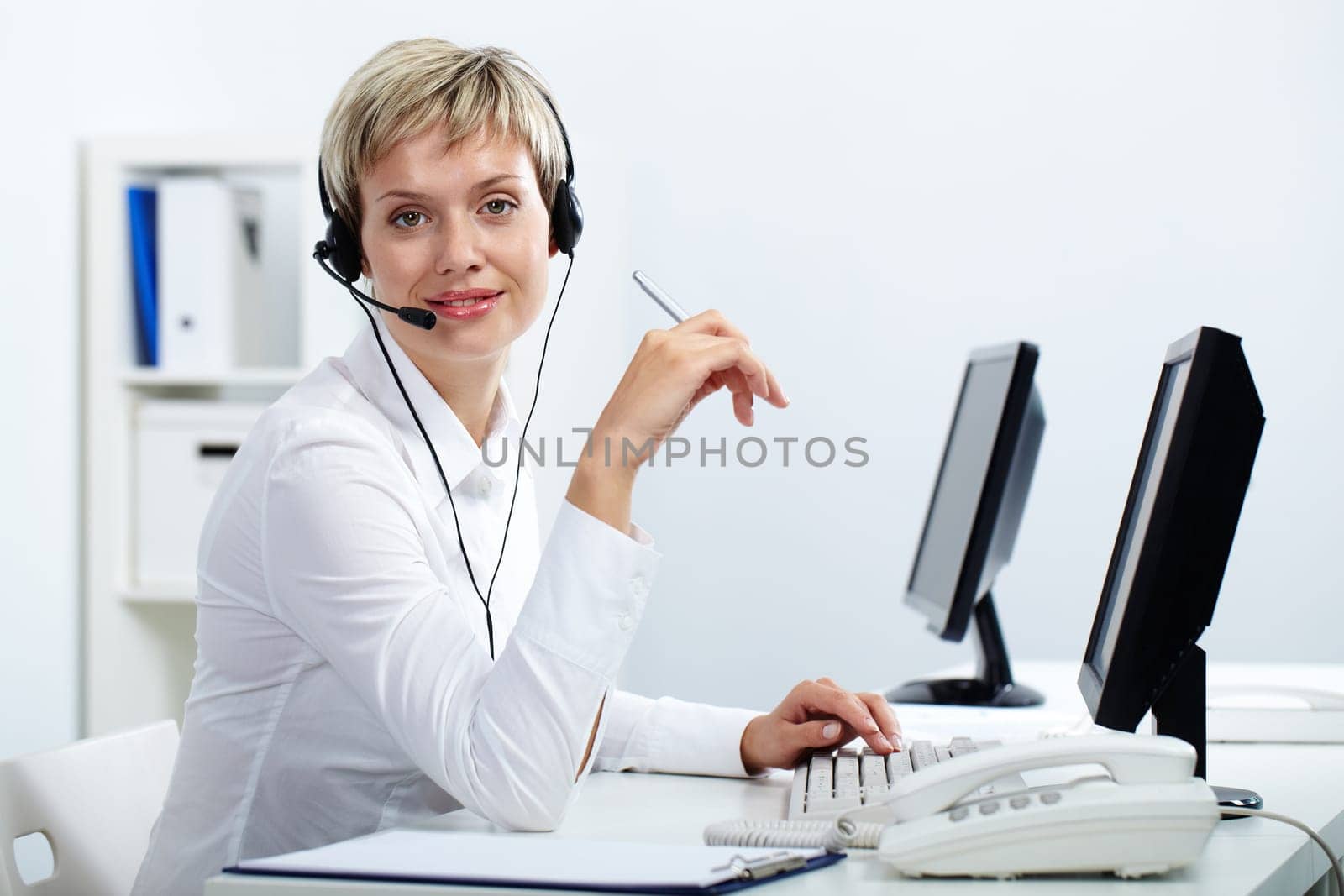 Portrait of office manager working in waiting room