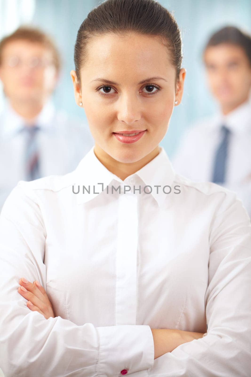 Portrait of a serious businesswoman standing with her hands crossed