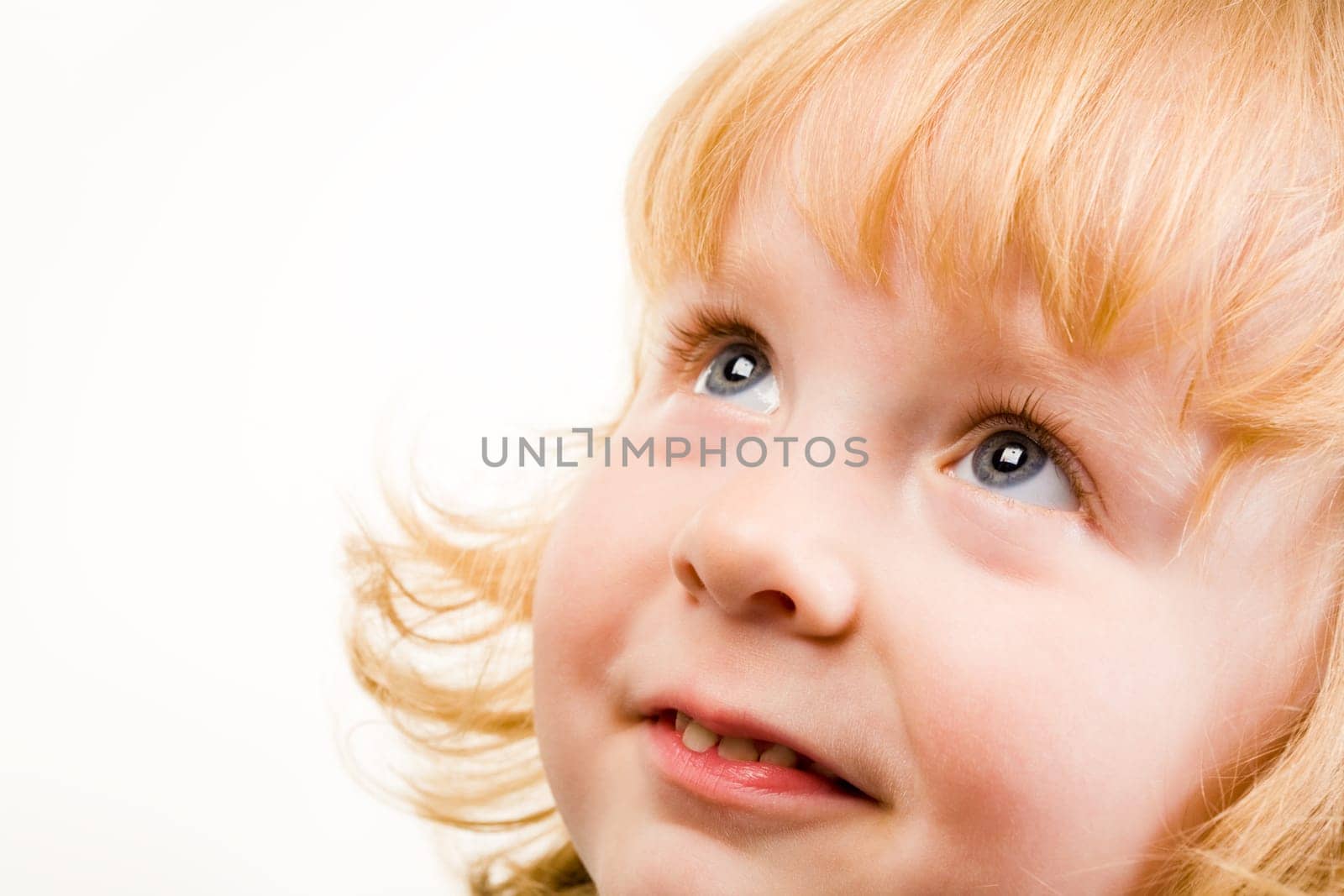 Portrait of pretty young girl looking up