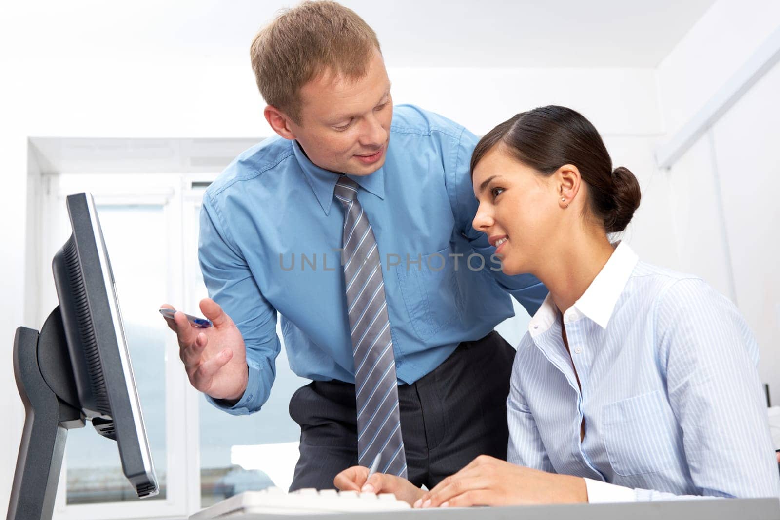 Manager giving opinion to his secretary