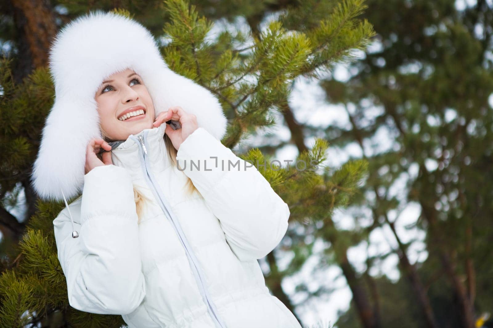 Photo of lovely woman walking out in forest on winter day