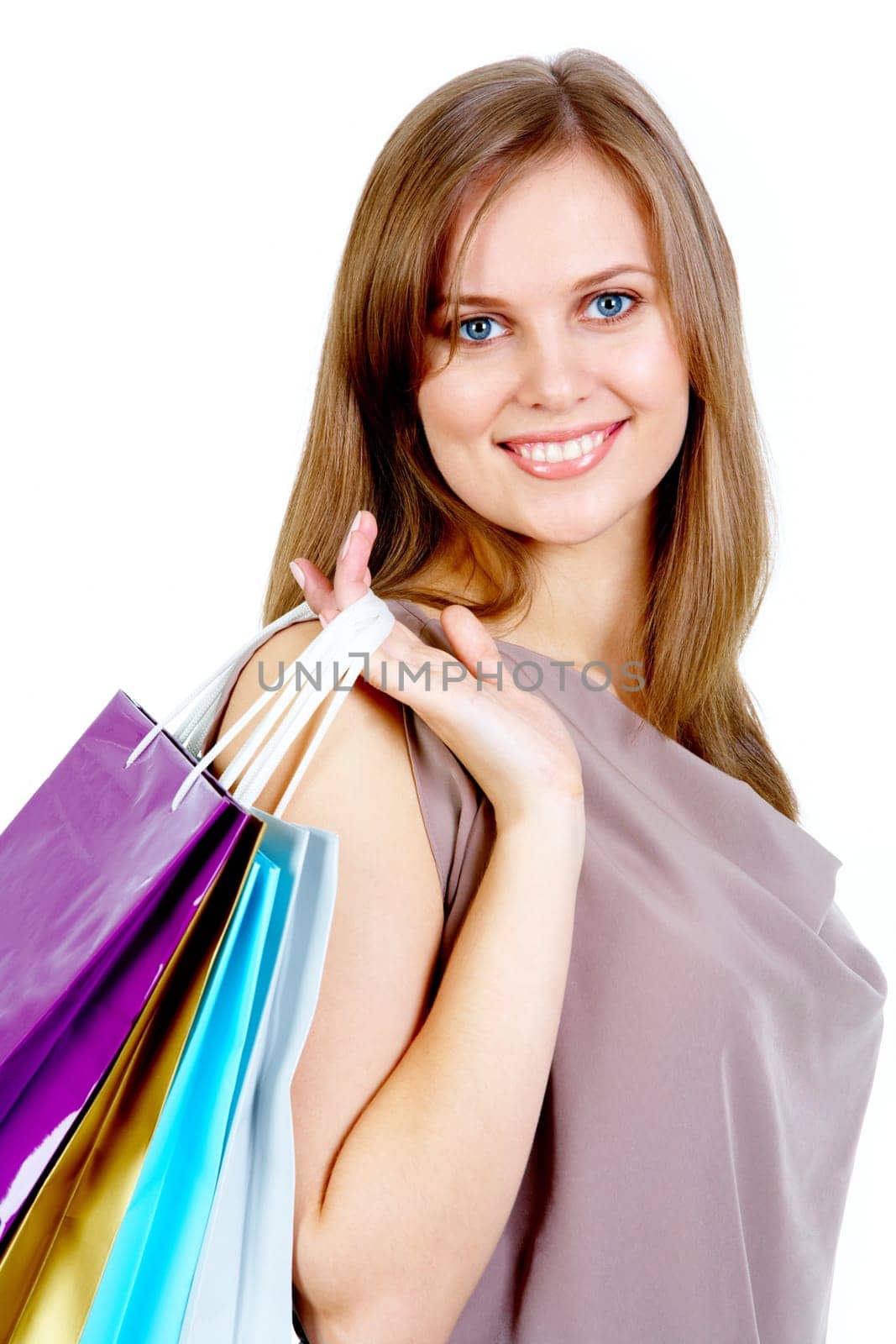 Happy female after shopping smiling at camera
