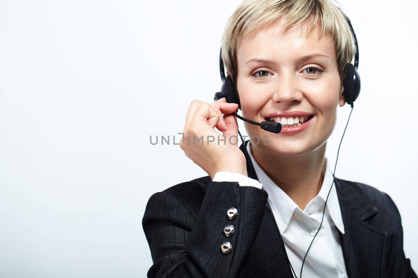 Portrait of friendly customer service representative isolated on white
