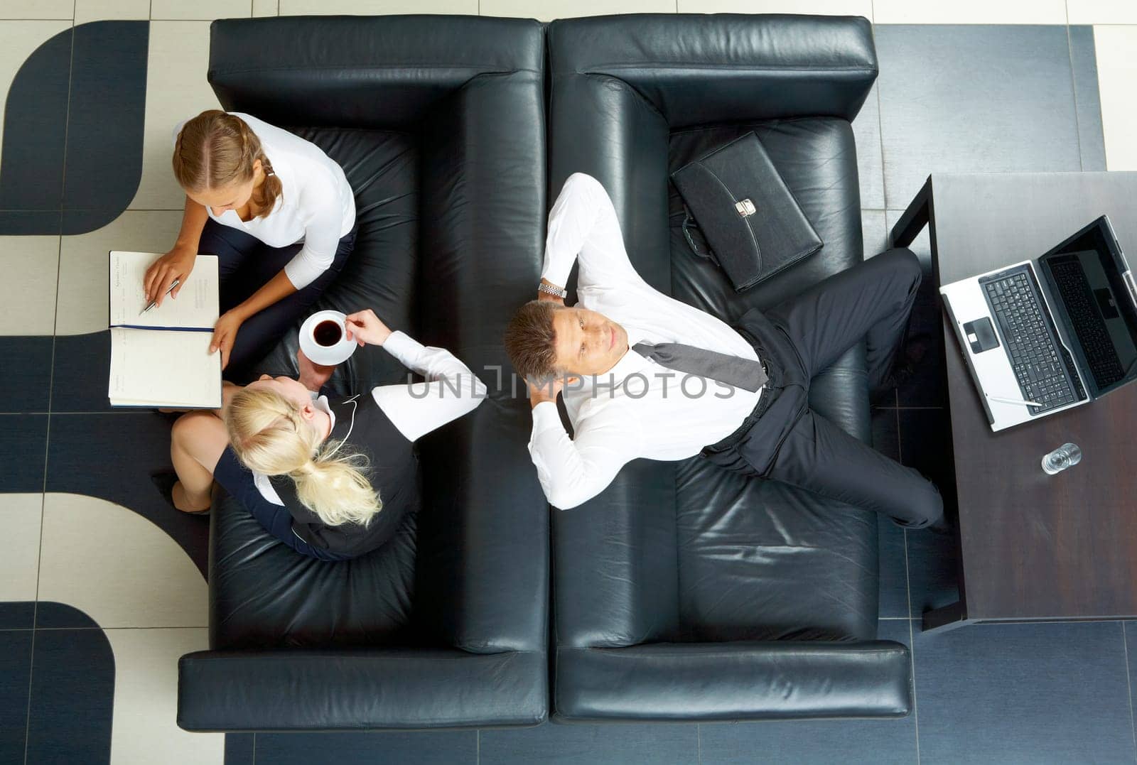 Photo of successful employees thinking of new ideas in office