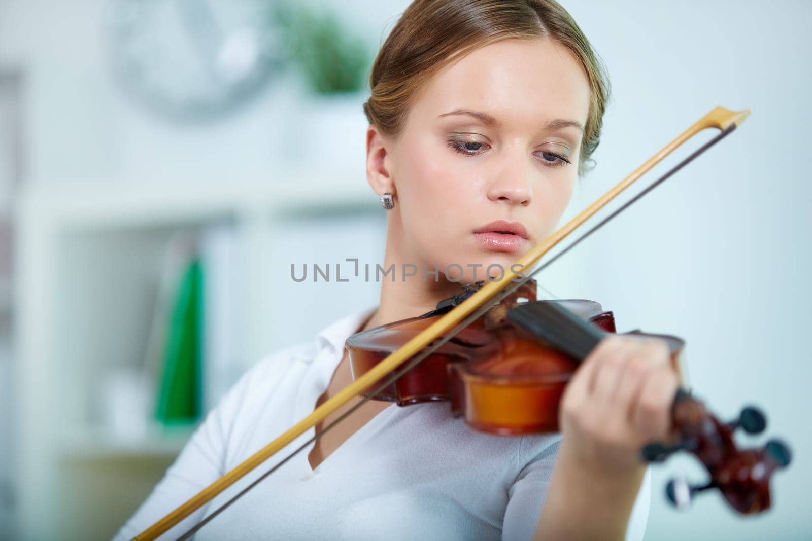 Portrait of a young female playing the violin