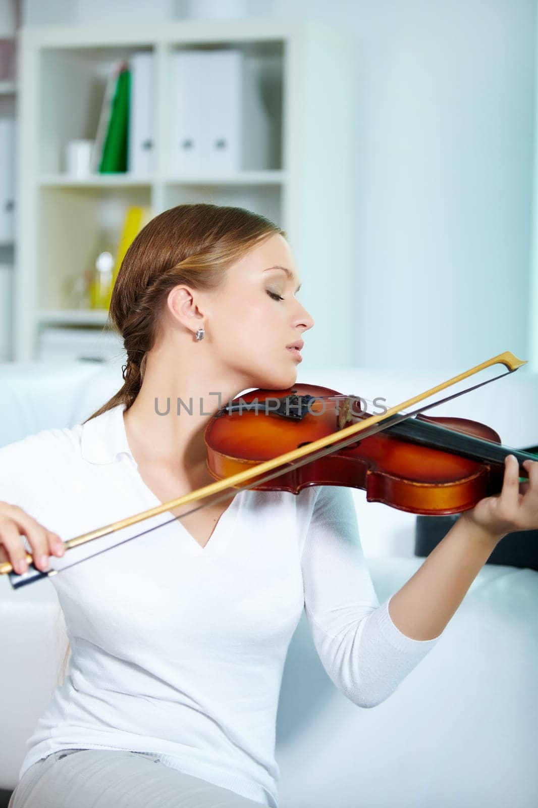 Portrait of a young female playing the violin