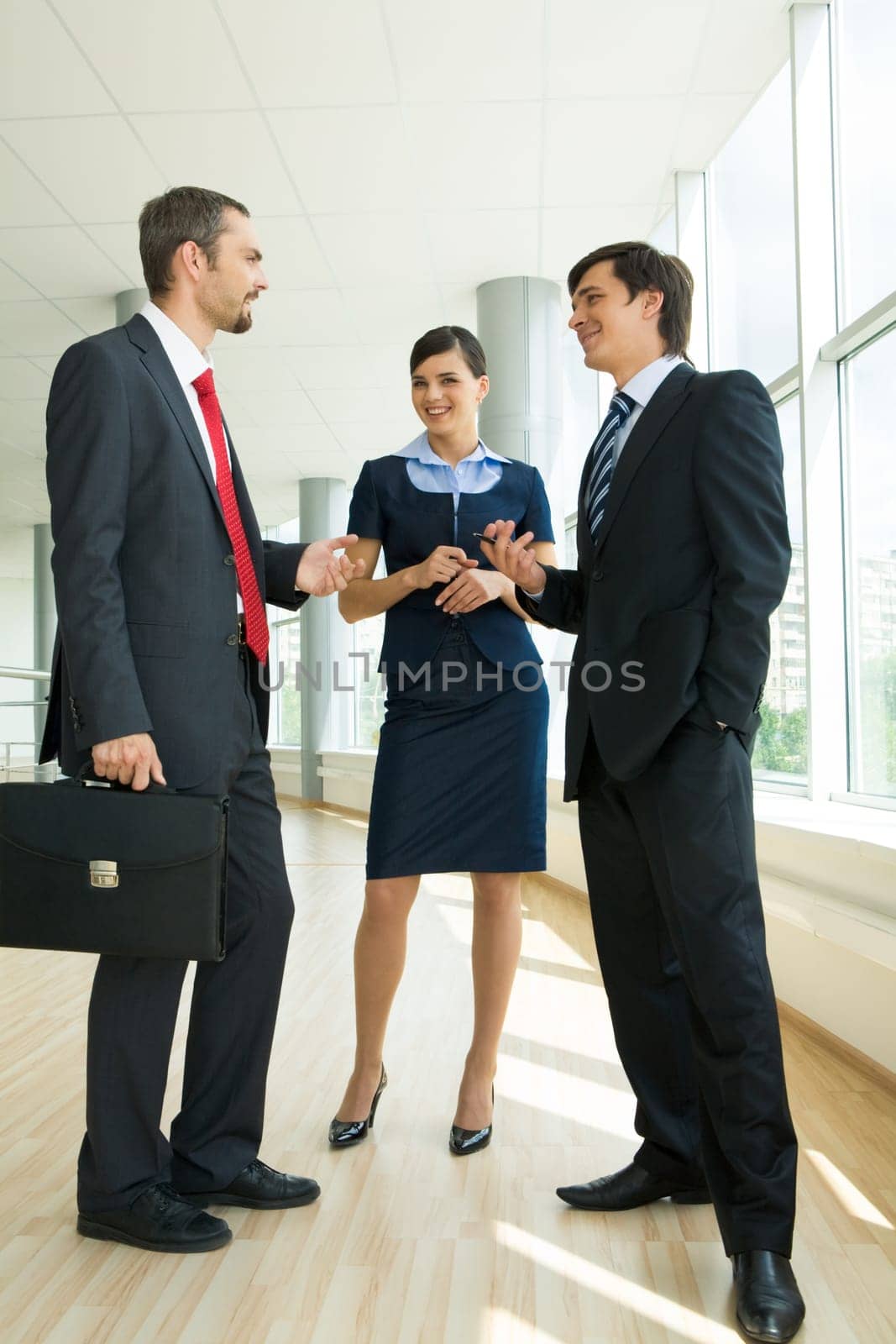 Photo of confident businessteam planning work or consulting each other