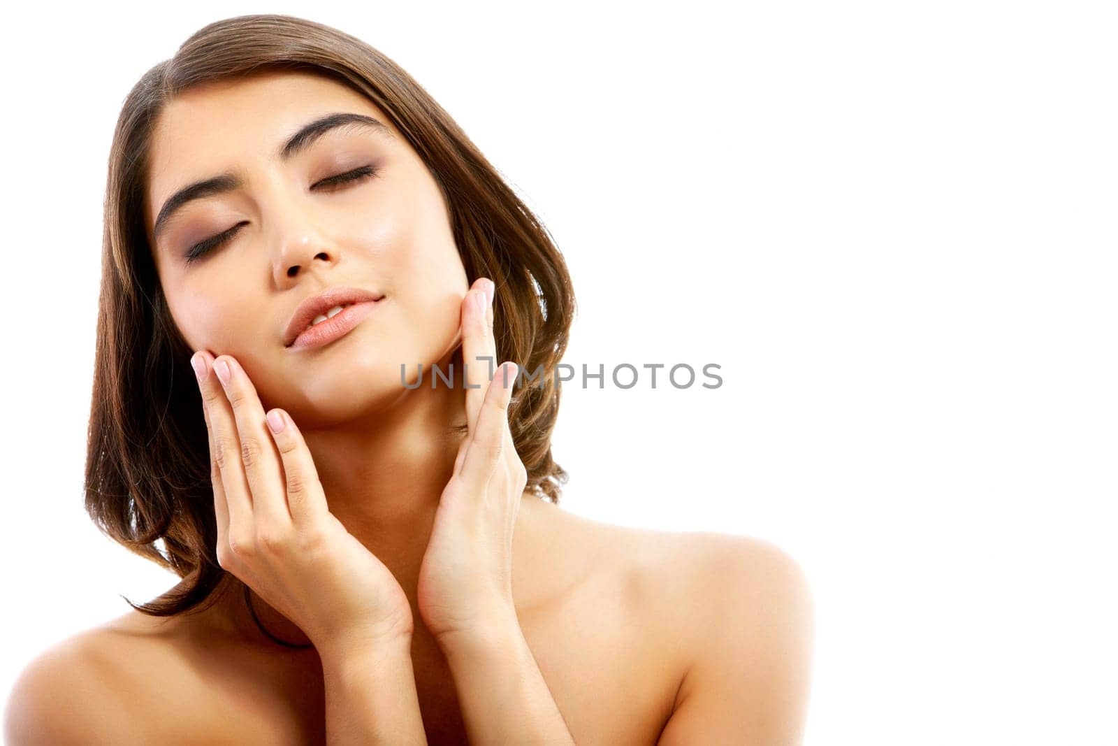 Portrait of pretty enjoying woman touching her face