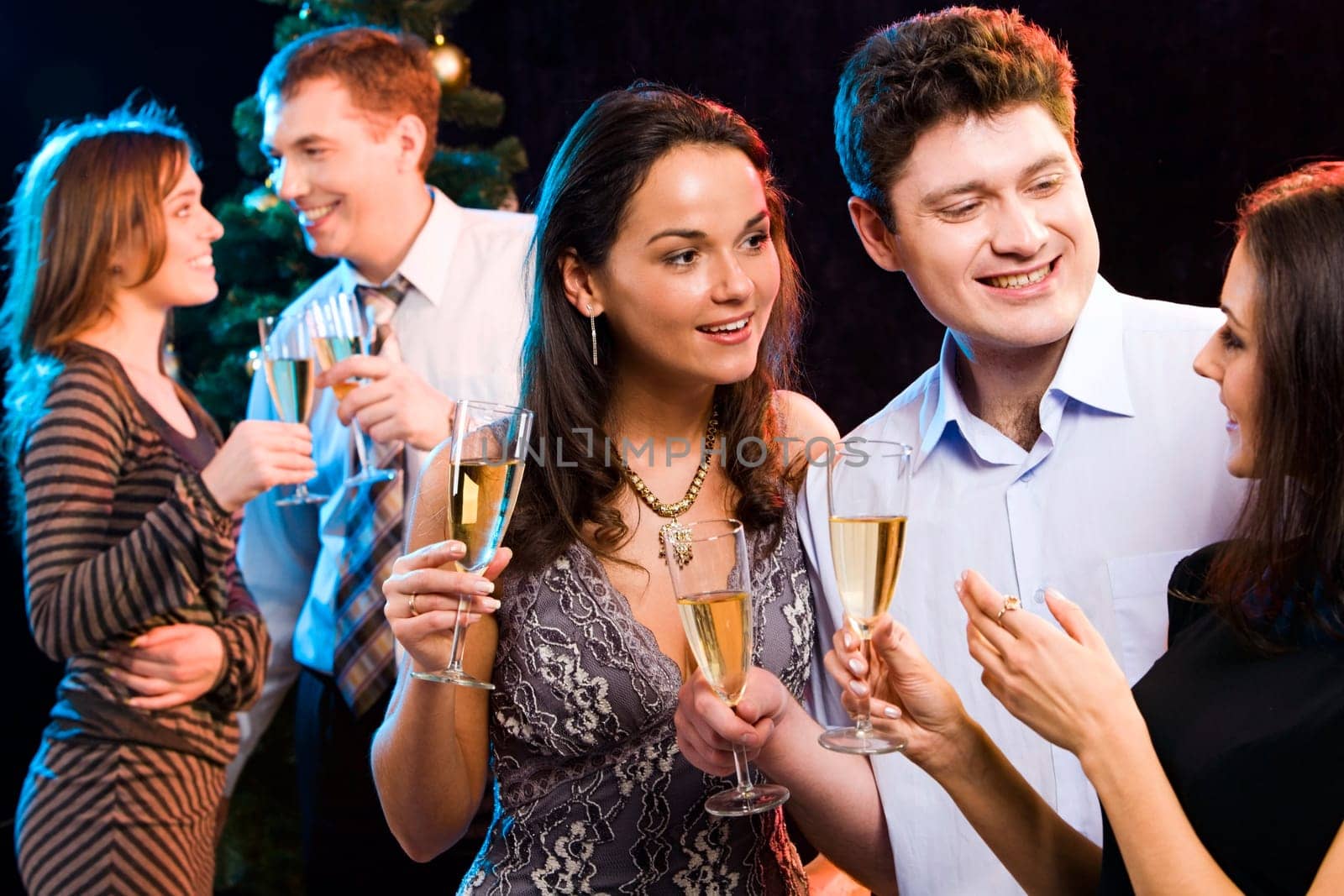Portrait of smiling people interacting each other at a party