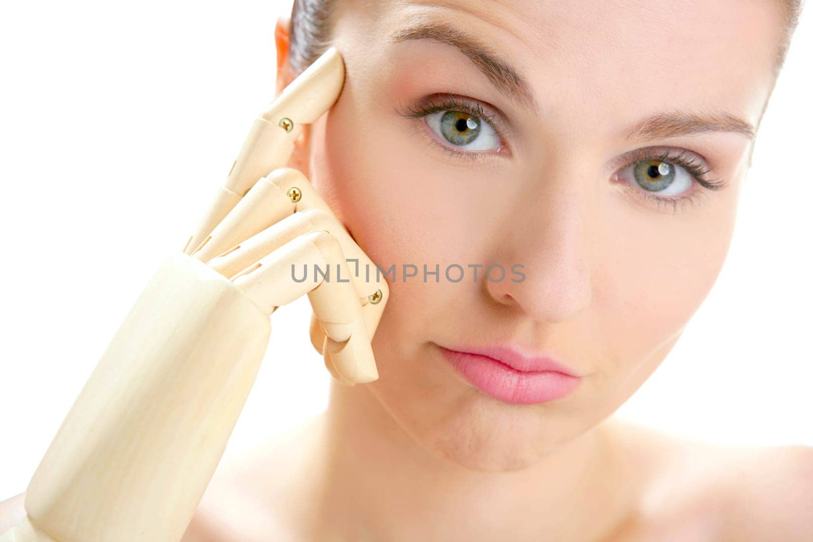 Funny woman cosmetic portrait, thinking with mannequin wooden hand