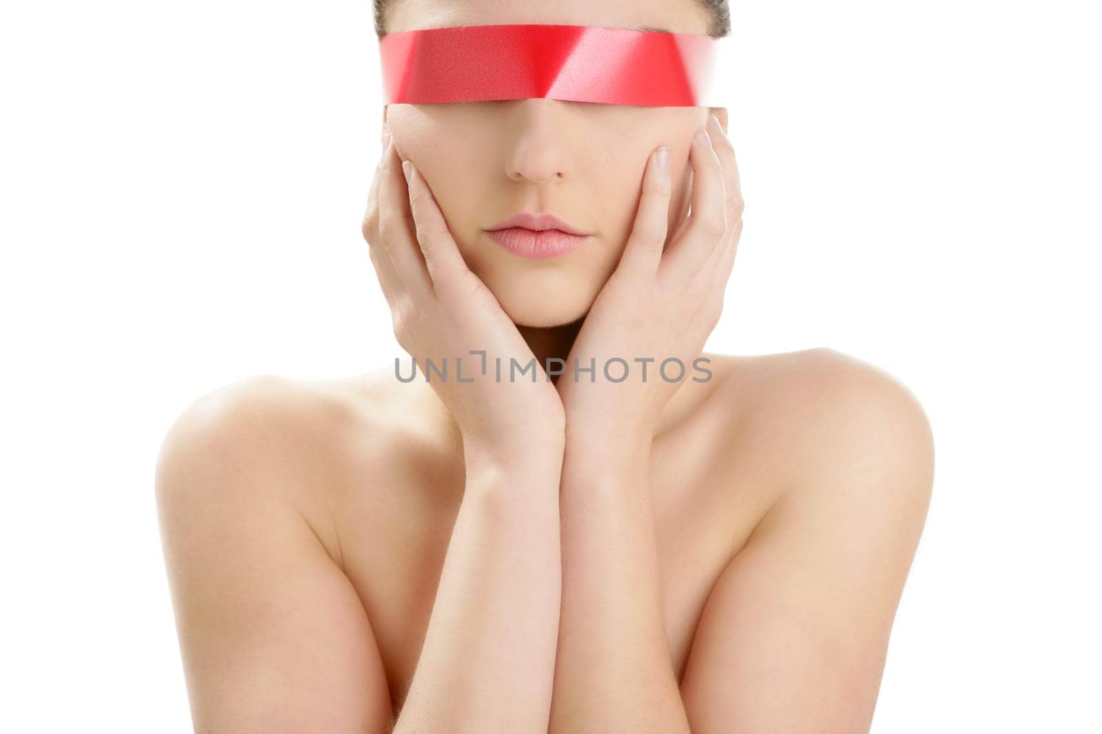 Beautiful woman portrait with hands on head isolated on white at studio