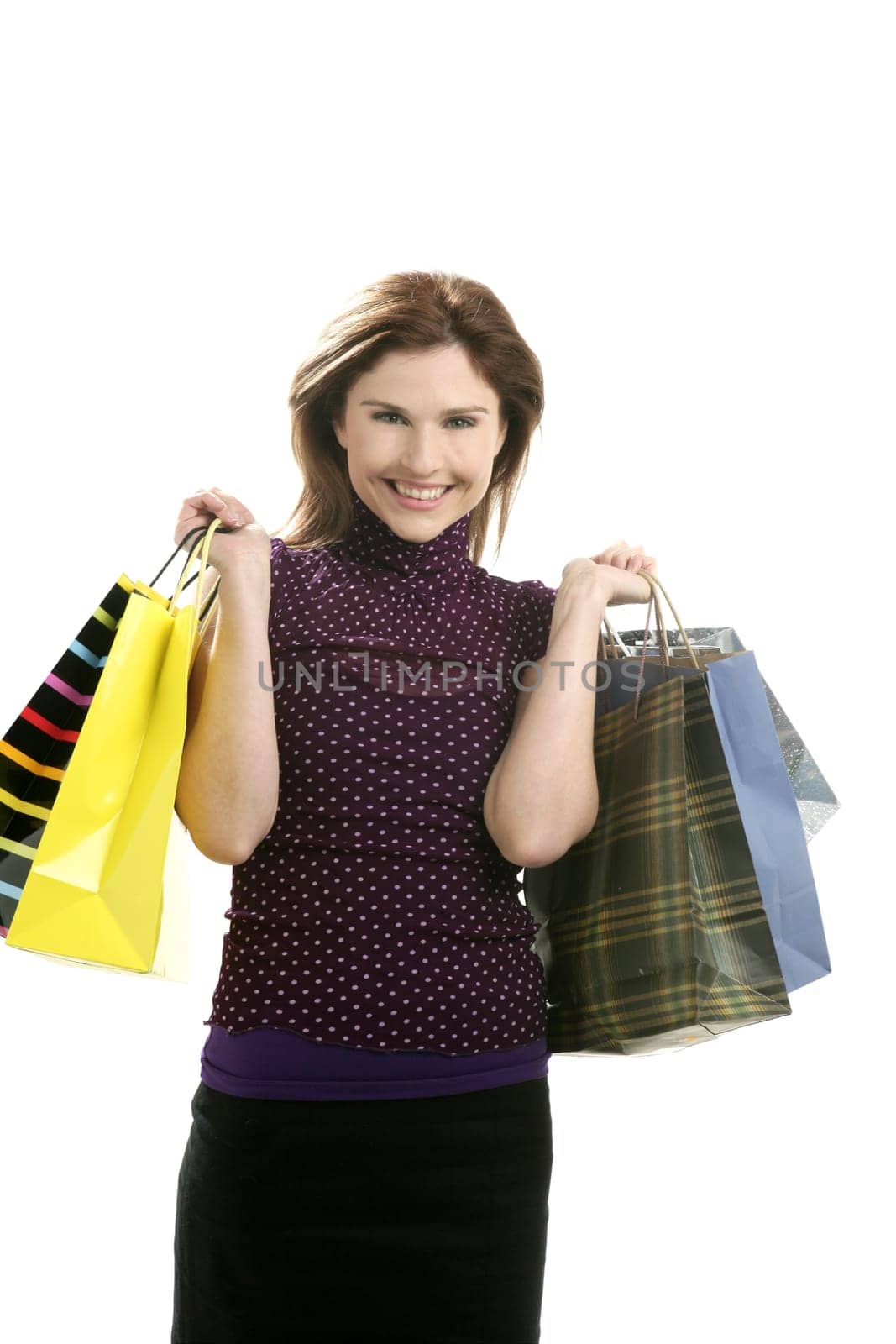 Shopaholic woman shopping with colorful bags isoalted on white