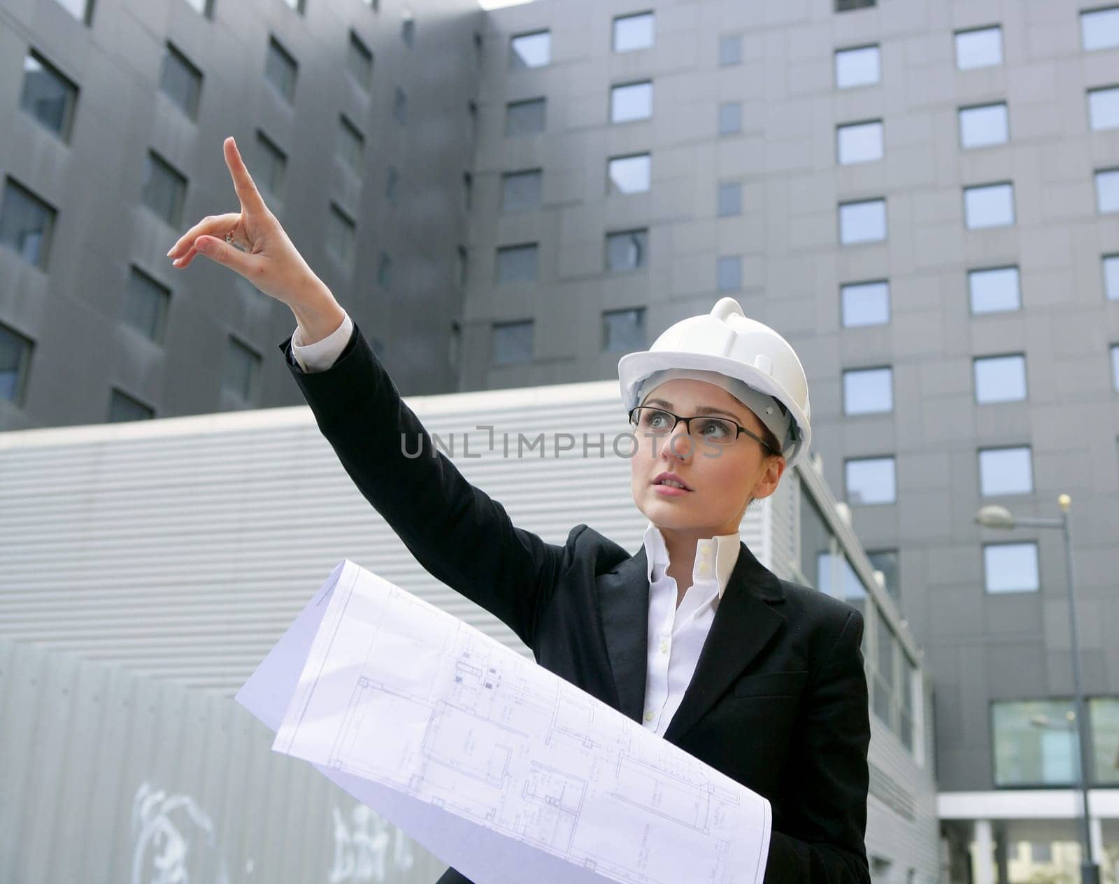 architect woman working outdoor with modern buildings