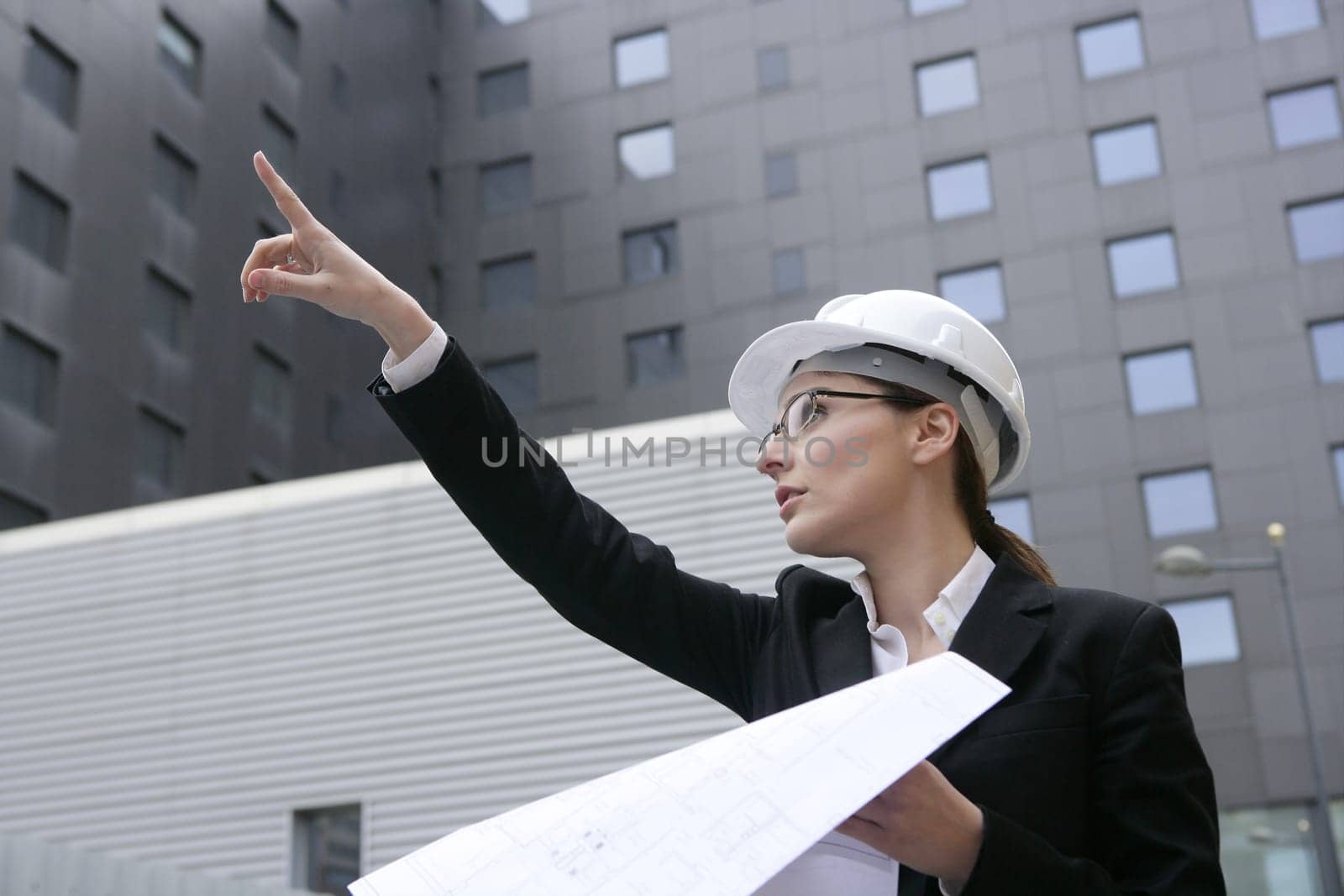 architect woman working outdoor with modern buildings