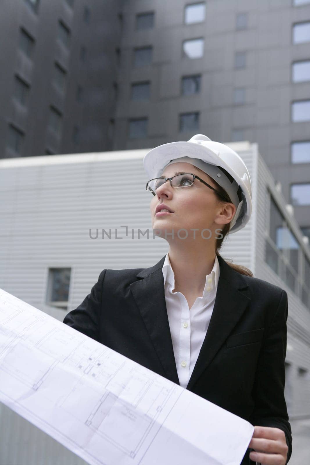 architect woman working outdoor with modern buildings