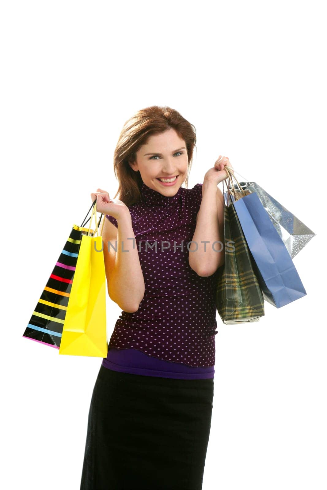 Shopaholic woman shopping with colorful bags isoalted on white