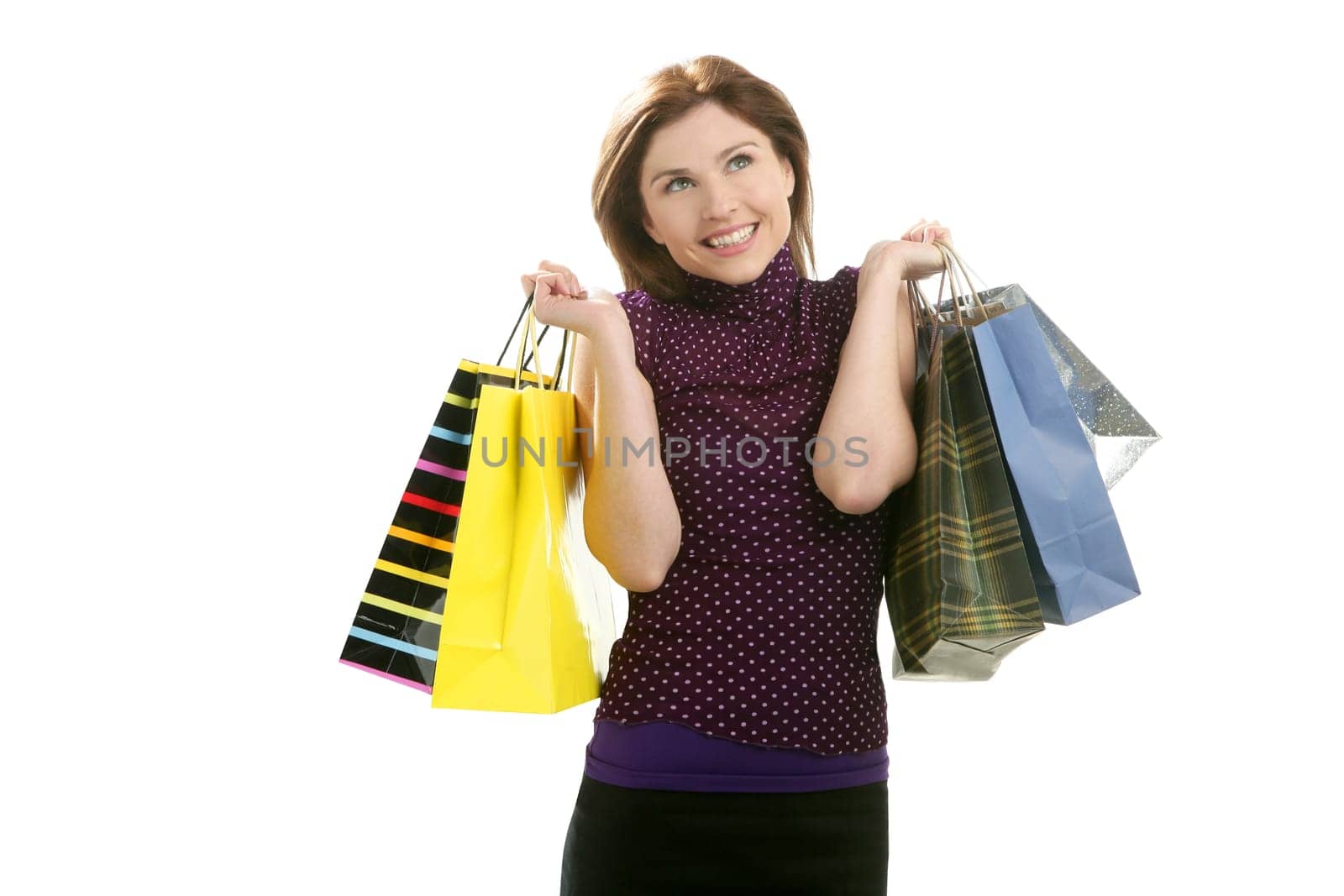 Shopaholic woman shopping with colorful bags isoalted on white