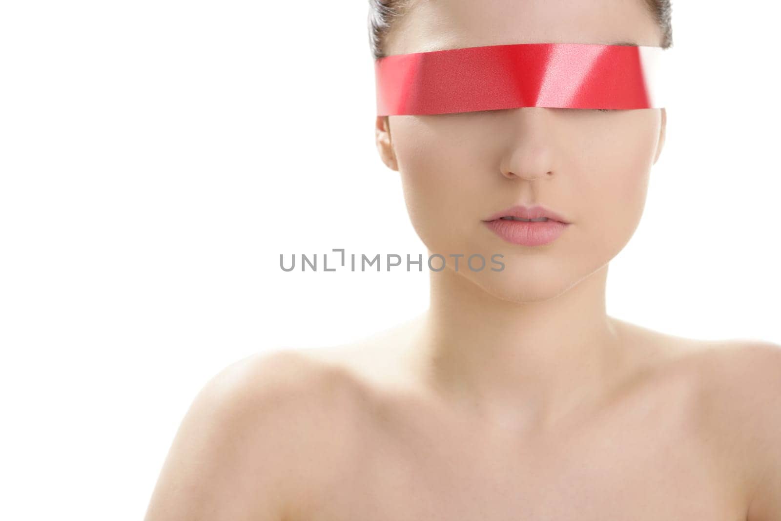 Beautiful cosmetic woman clean portrait, with red tape in eyes