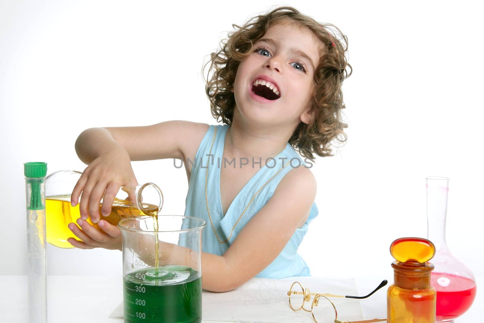 Beautiful chemistry little girl playing on a laboratory
