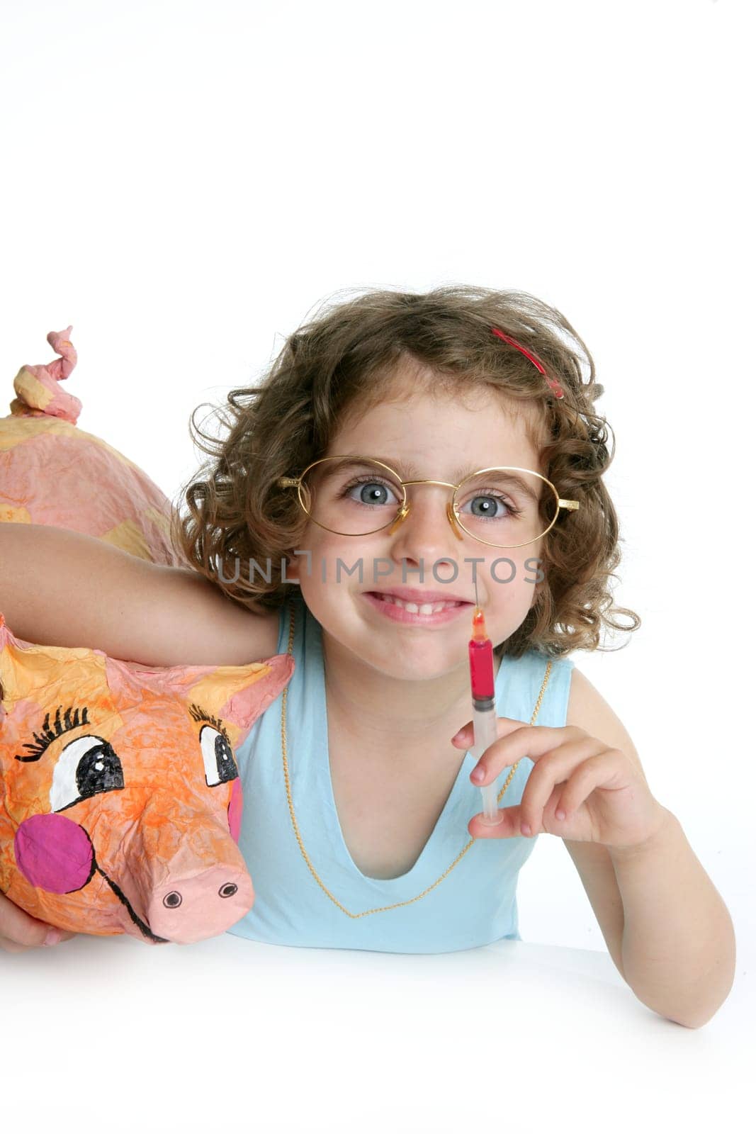 Little girl pretending to be a veterinary with a pig, AH1N1 flu
