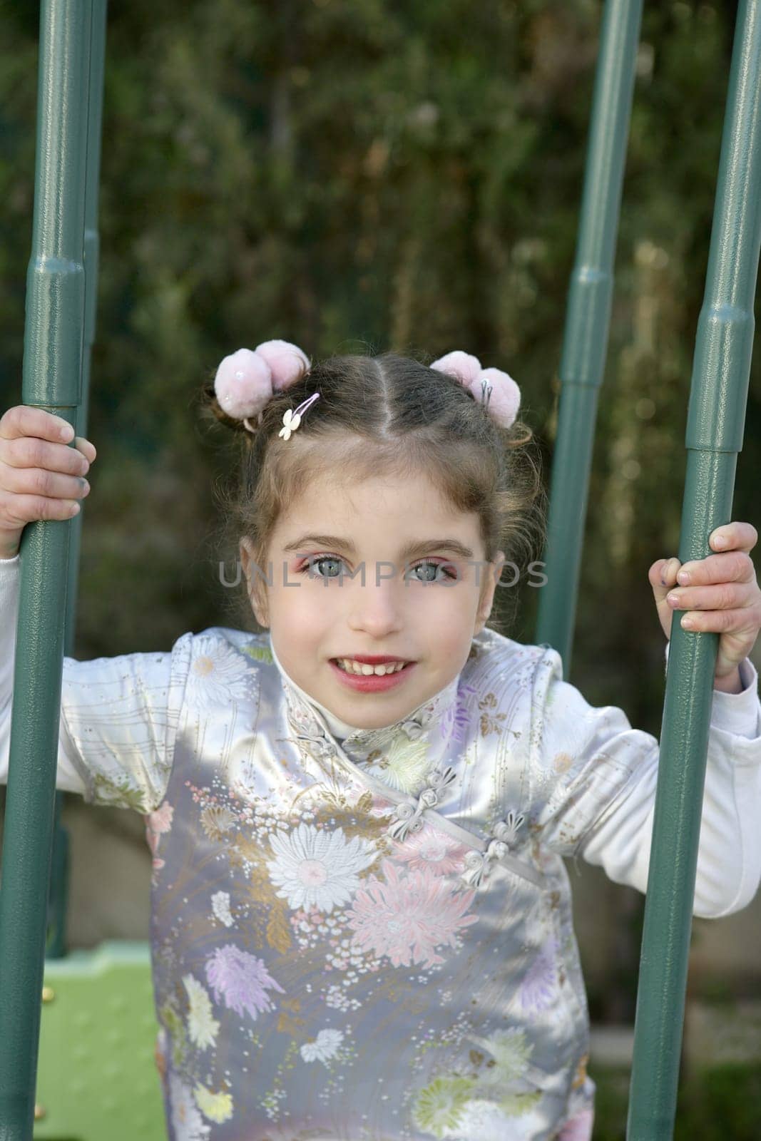 Beautiful caucasian little girl outdoor with asian dress ans makeup