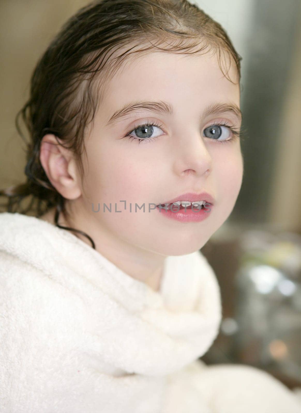 beautiful smiling girl with white towel in bathroom