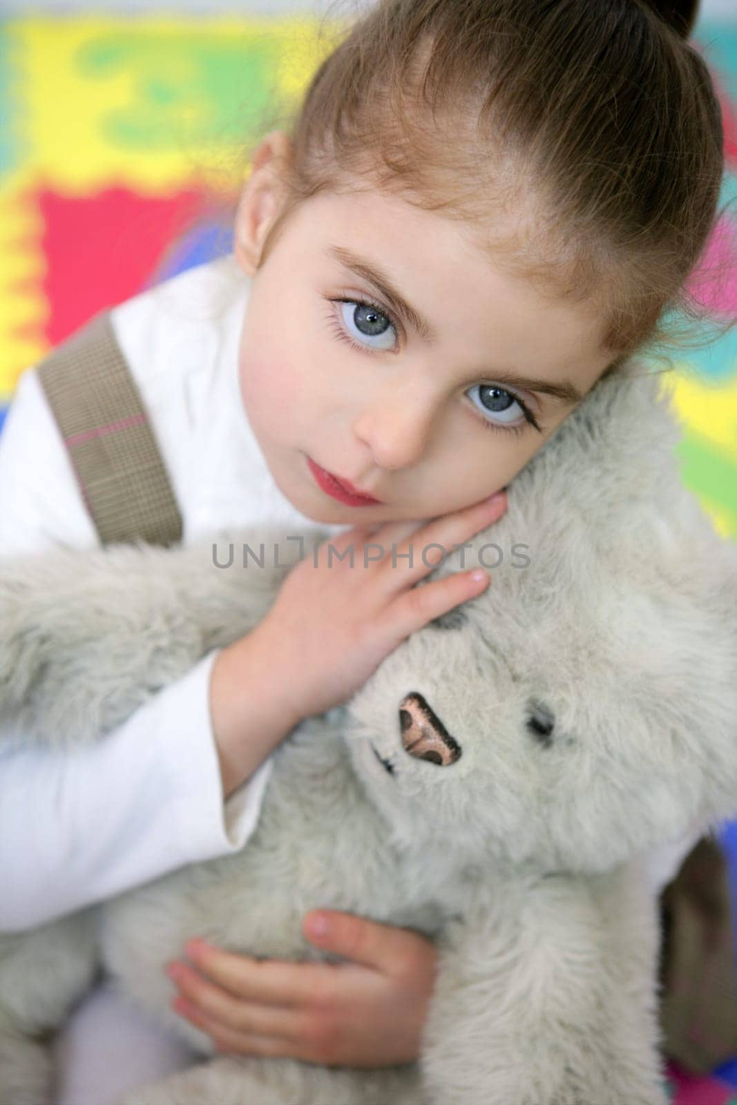 Beautiful preschooler student little girl hug her teddy bear