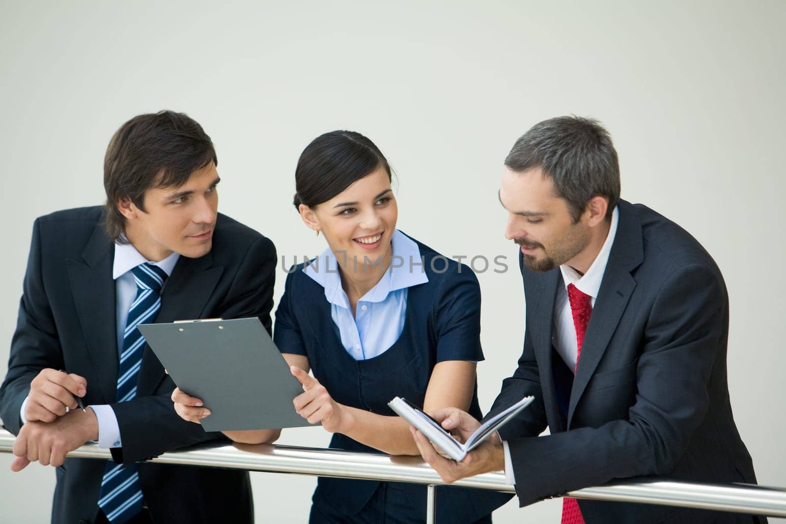 Portrait of busy people discussing new working plan at meeting