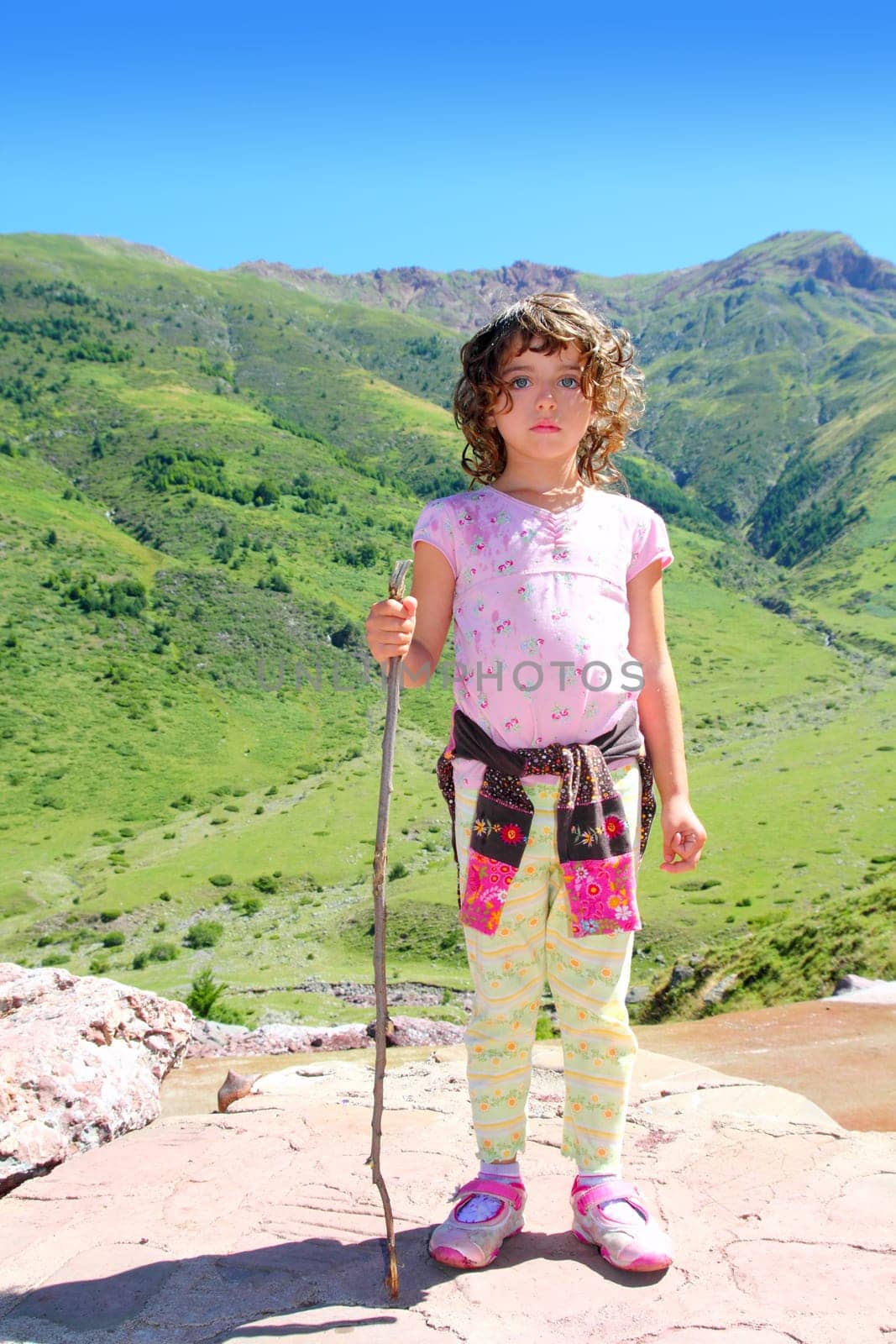 Explorer mountain girl hicker stick cane green outdoor valley landscape