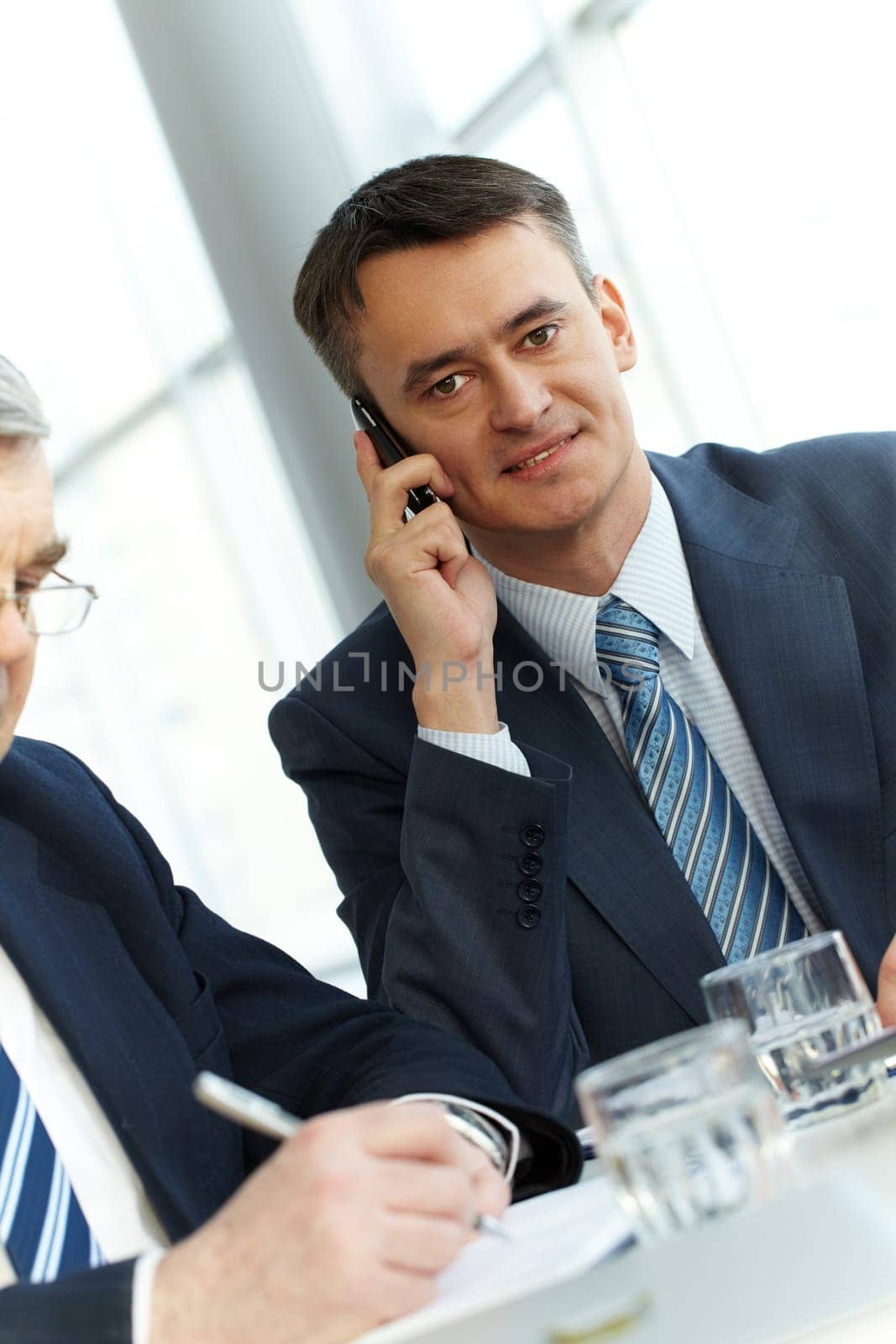 A young businessman talking on the phone