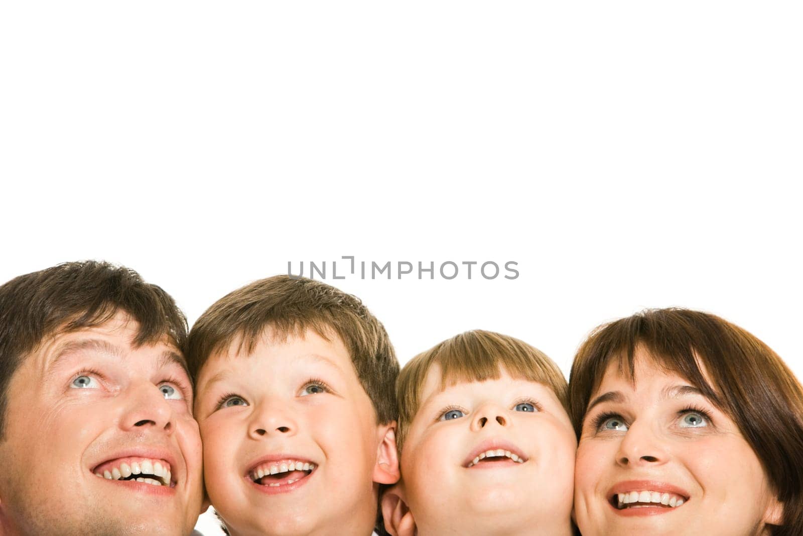 Photo of happy family looking upwards on white background
