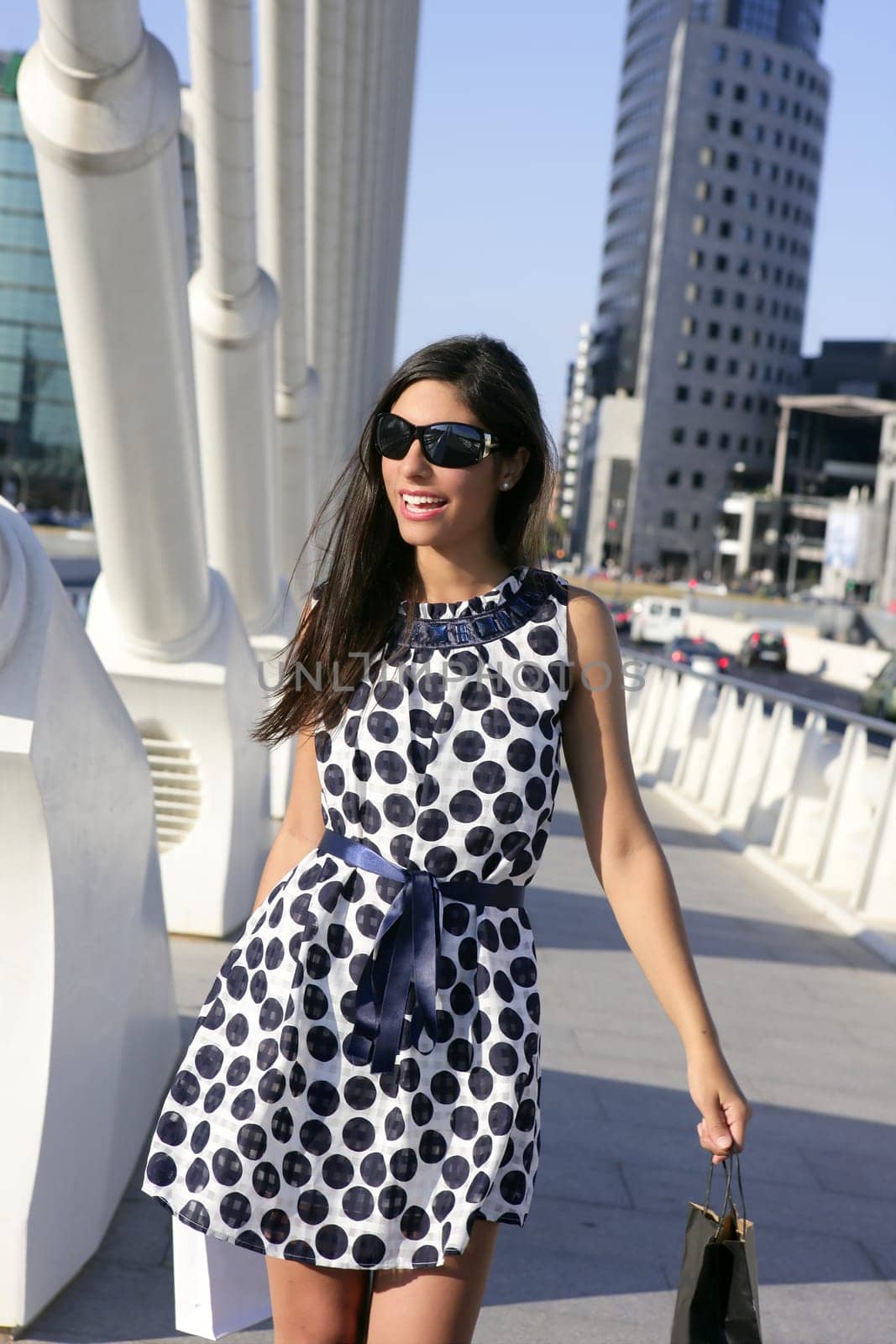 Beautiful brunette shopaholic outdoor modern city urban street