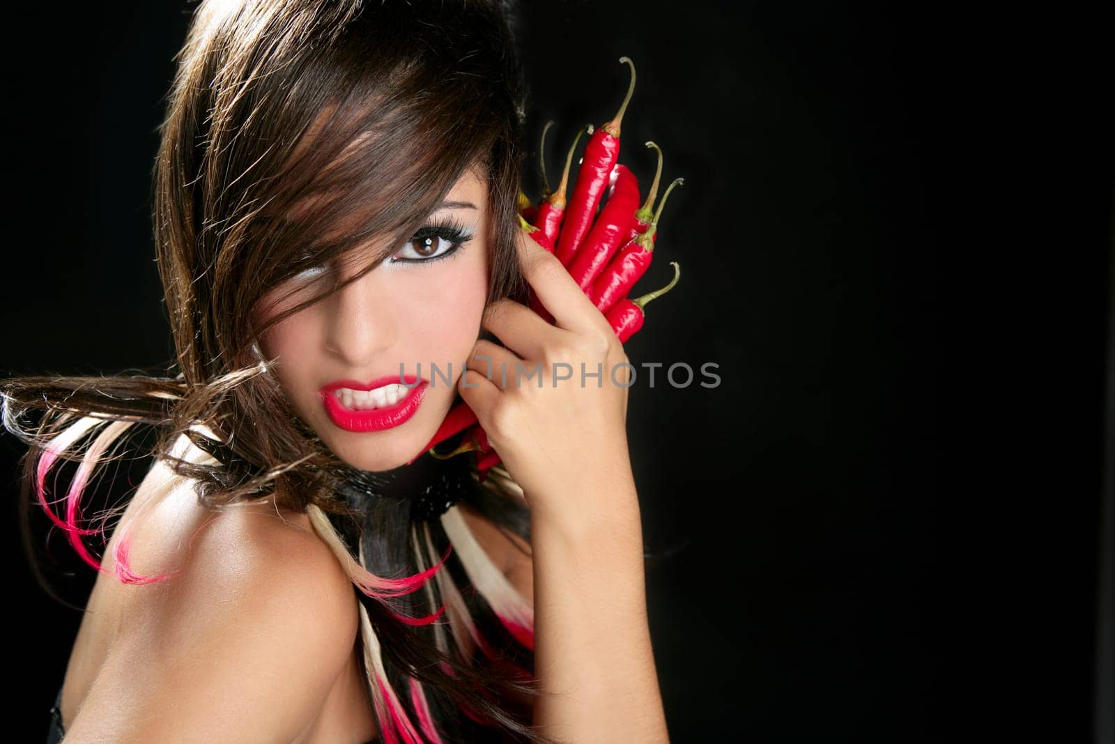 Attractive fashion brunette with red hot chili peppers