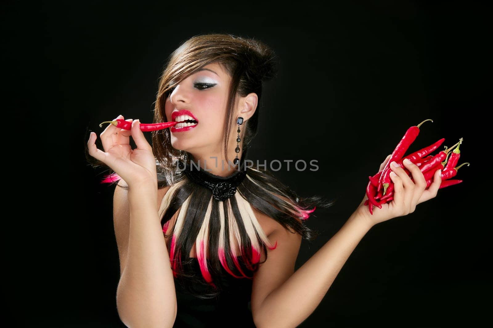 Attractive fashion brunette with red hot chili peppers