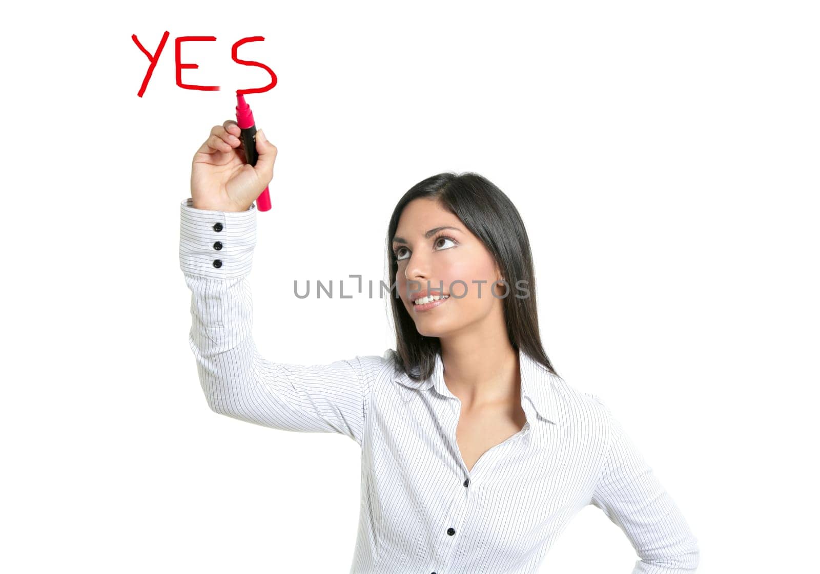 Brunette businesswoman writing word YES on a copyspace