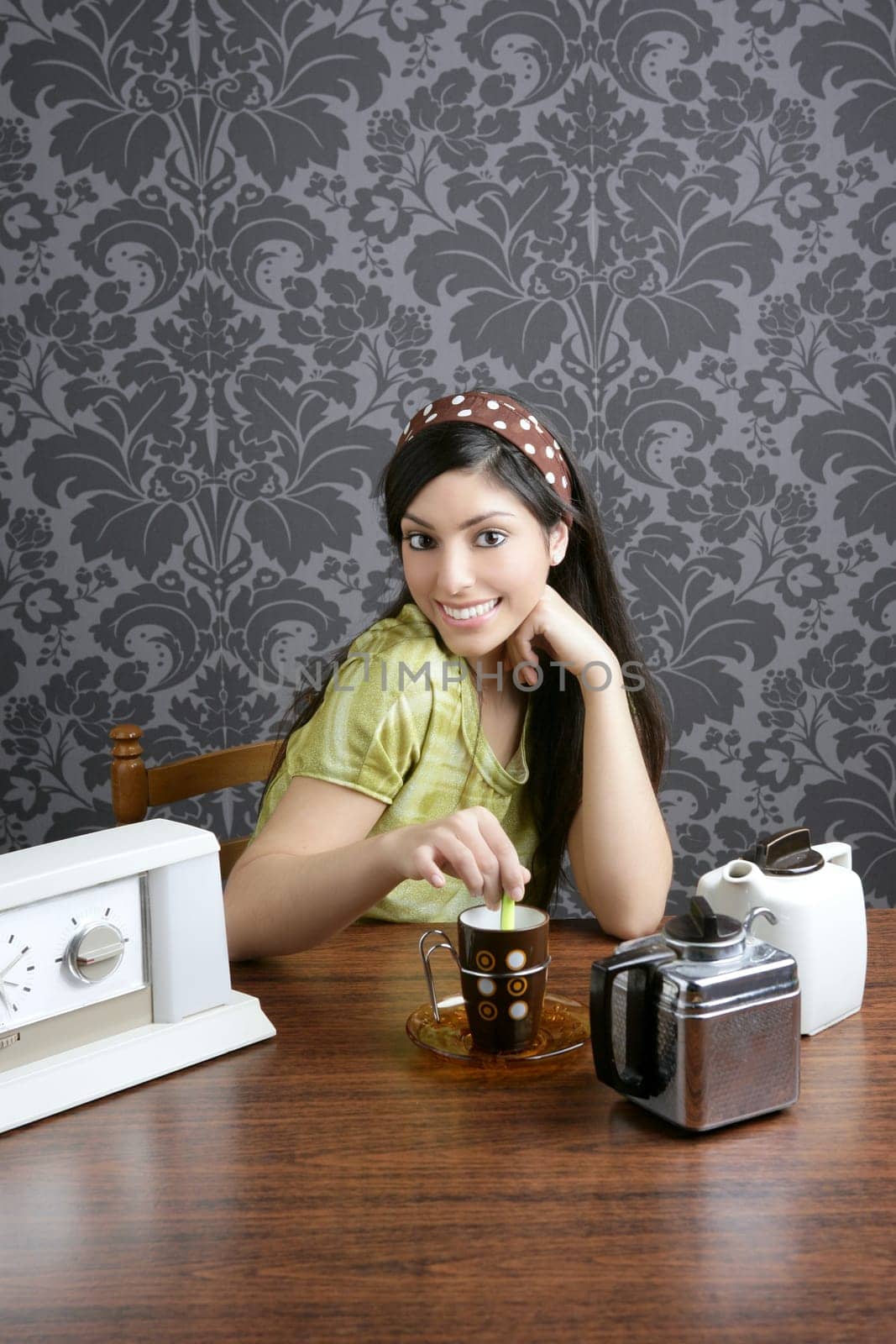 Retro woman drinking coffee on kitchen vintage wallpaper