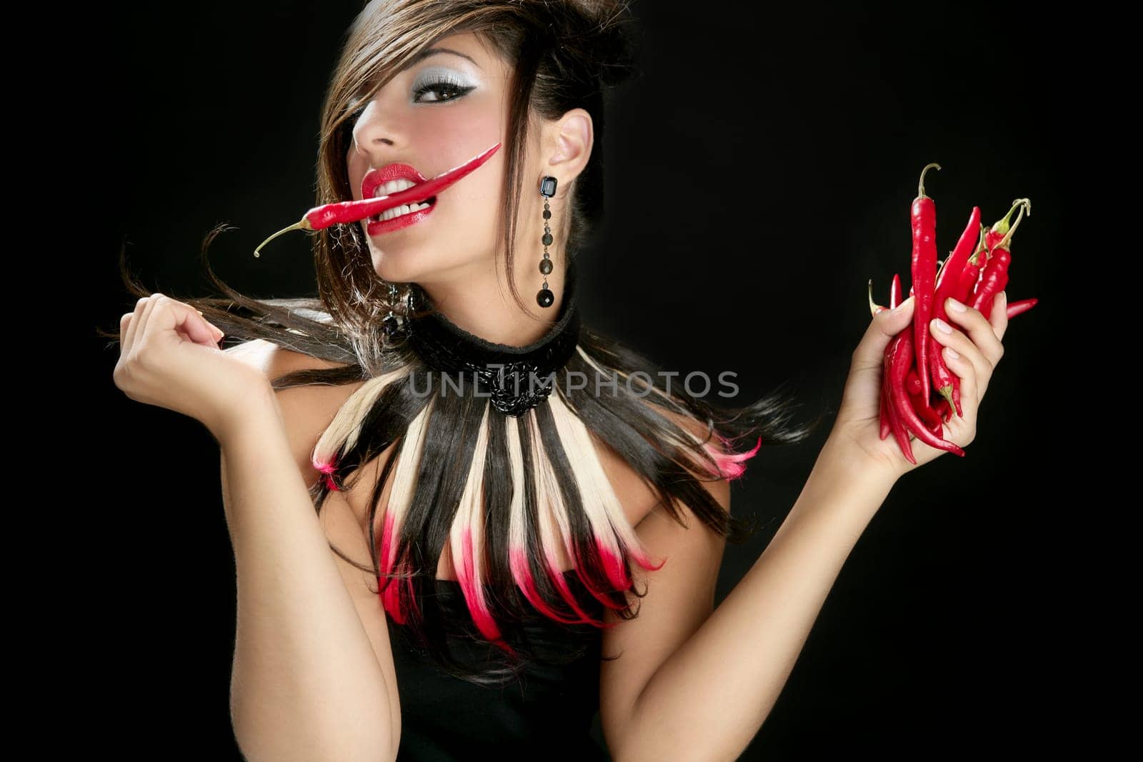 Attractive fashion brunette with red hot chili peppers