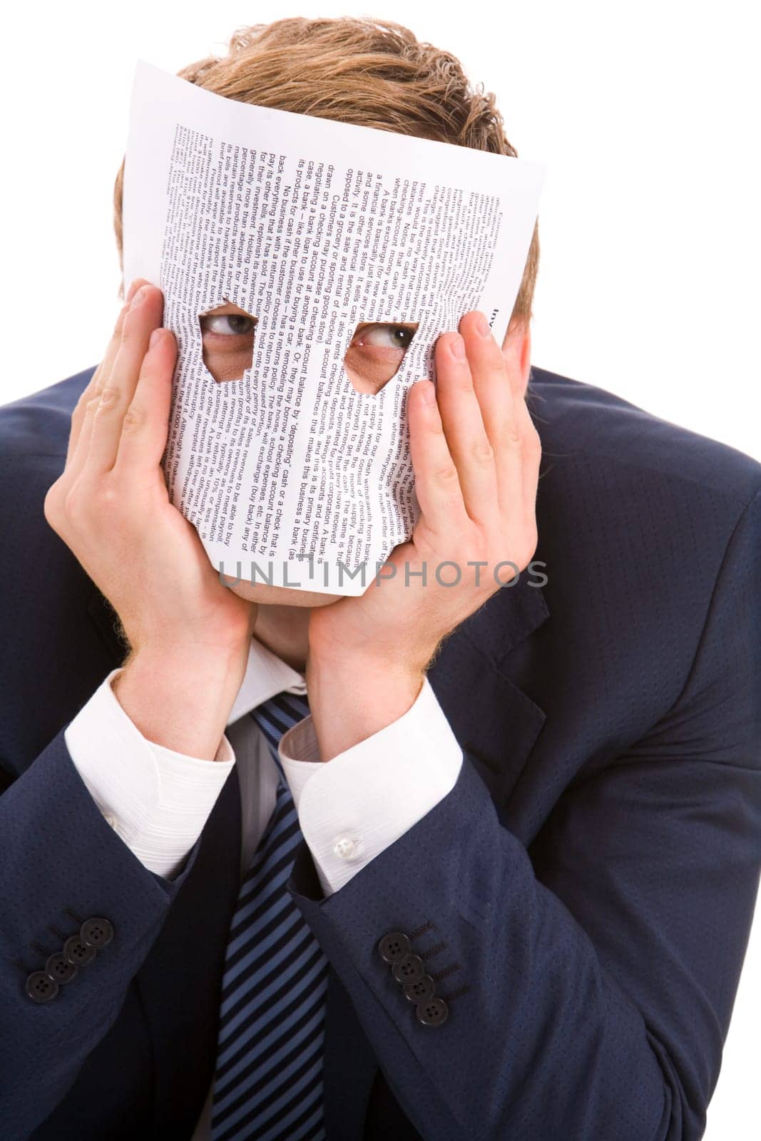 Portrait of businessman looking at camera through two holes in paper