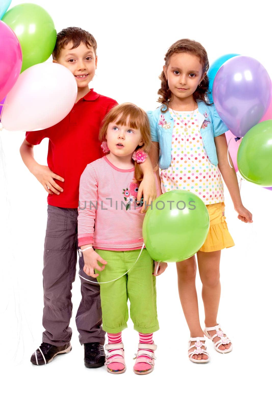 Portrait of kids with colorful balloons at birthday party