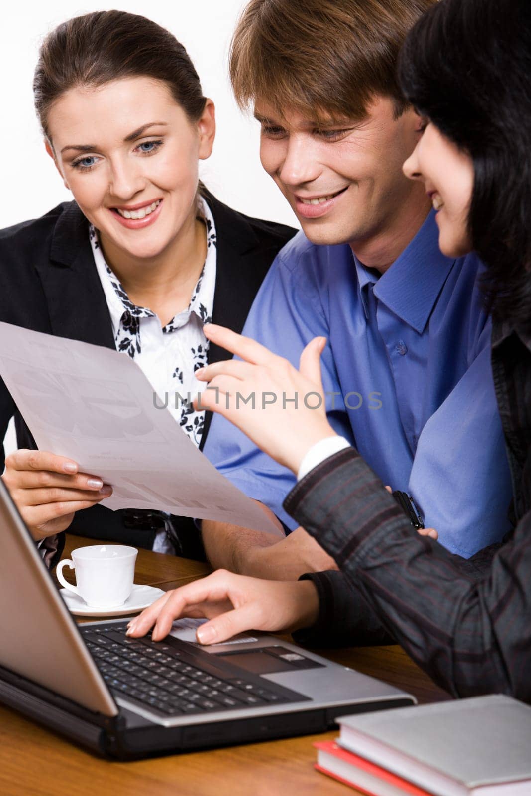 Two business demonstrating women a project to their boss