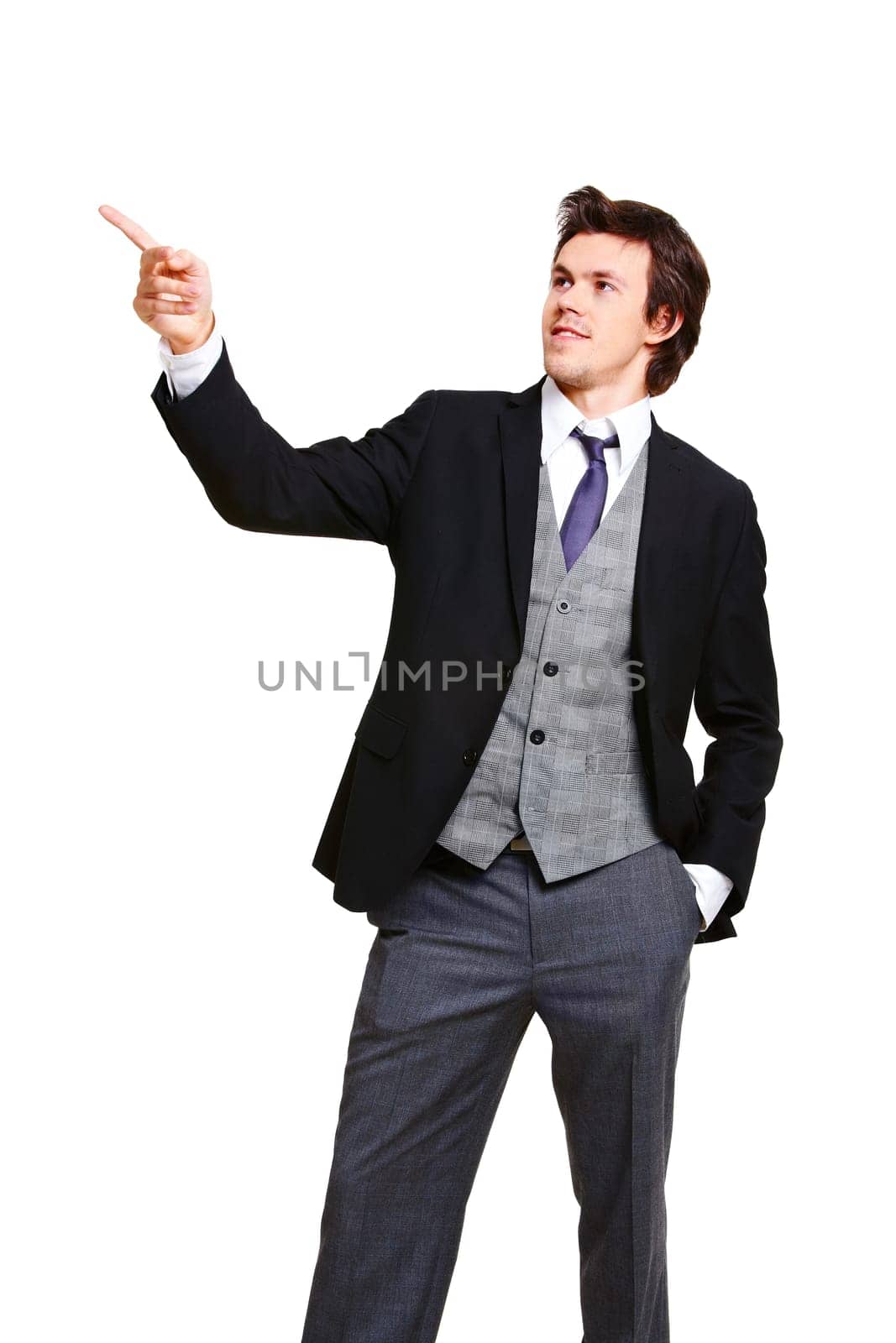 Portrait of stylish businessman in elegant suit pointing aside