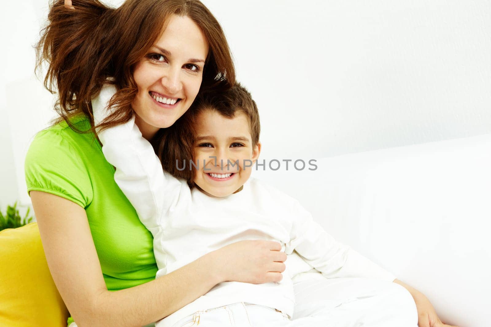 Family of happy mother and son looking at camera