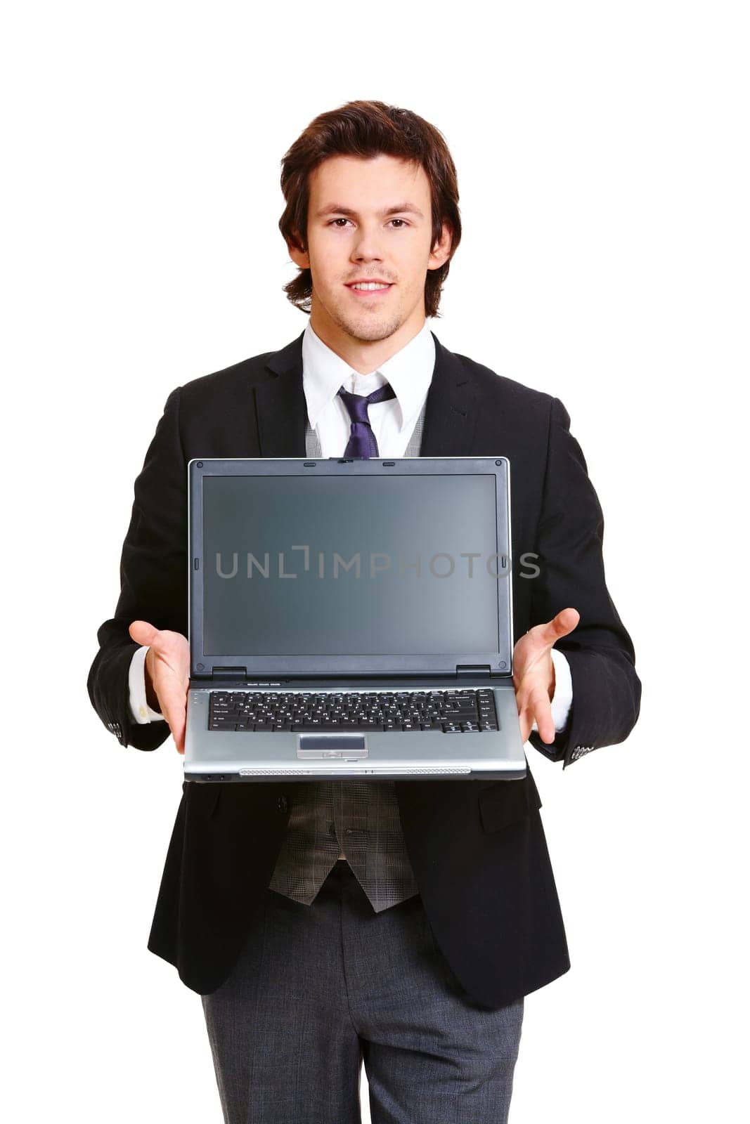 Portrait of elegant businessman showing laptop and looking at camera