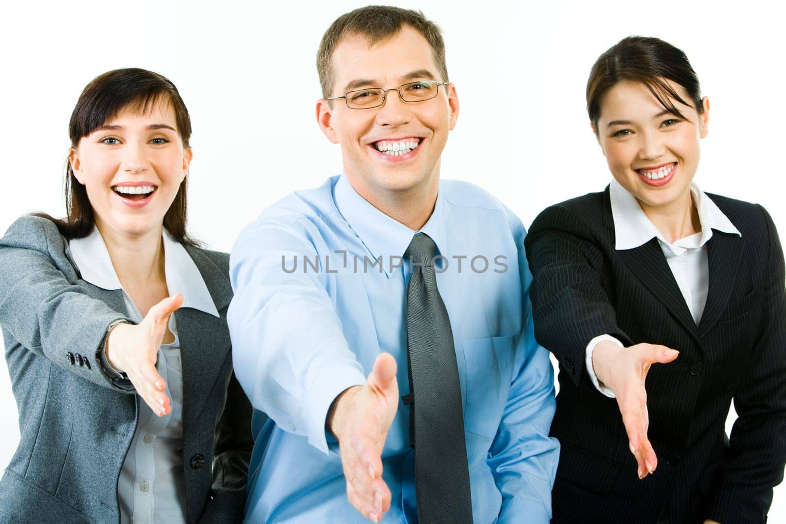 Portrait of happy business people giving hands to their partners and looking at camera