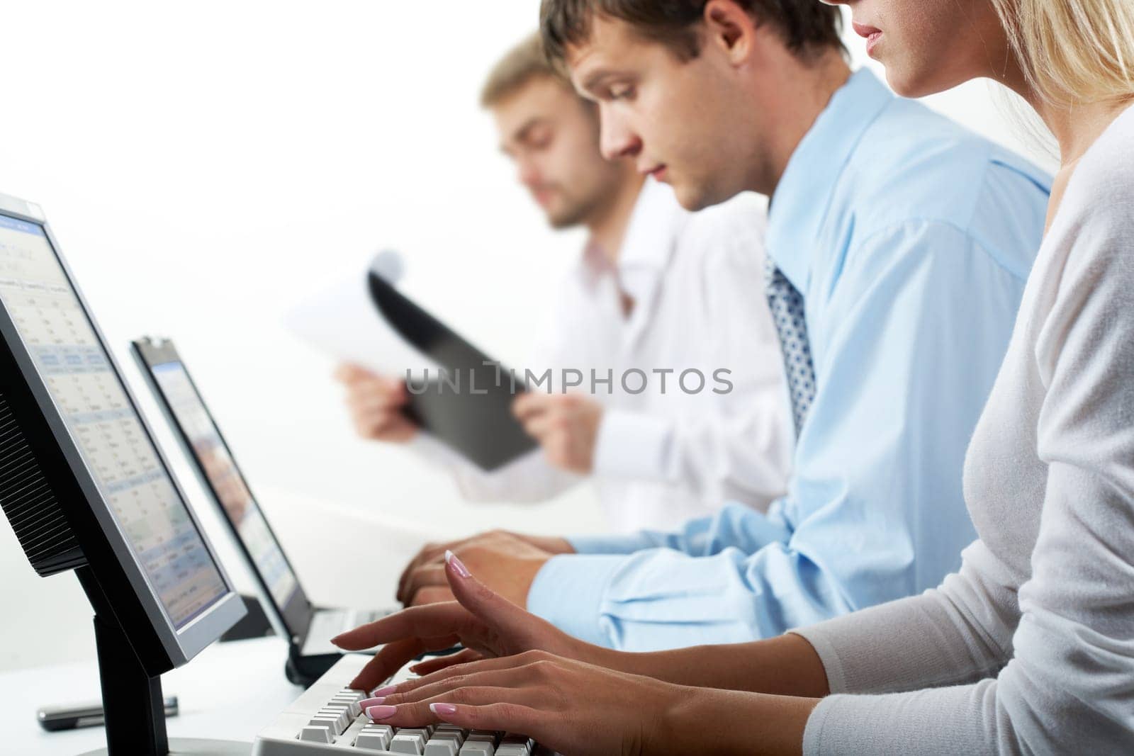 Image of female typing on keyboard in working environment