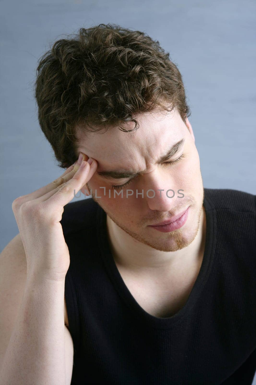 worried gesture pain young man stressed headache portrait